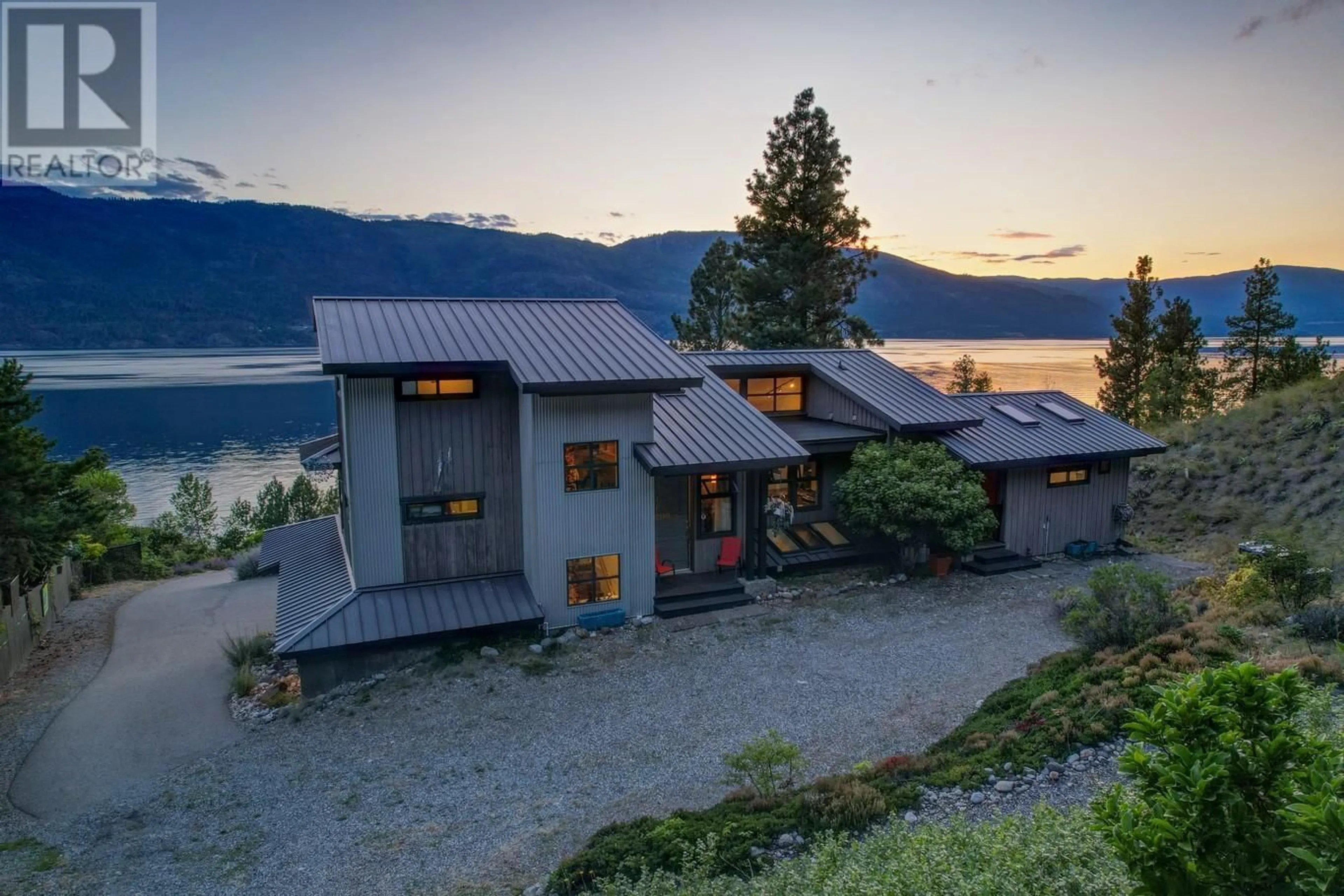 A pic from outside/outdoor area/front of a property/back of a property/a pic from drone, water/lake/river/ocean view for 10145 OKANAGAN CENTRE ROAD WEST, Lake Country British Columbia V4V2J4