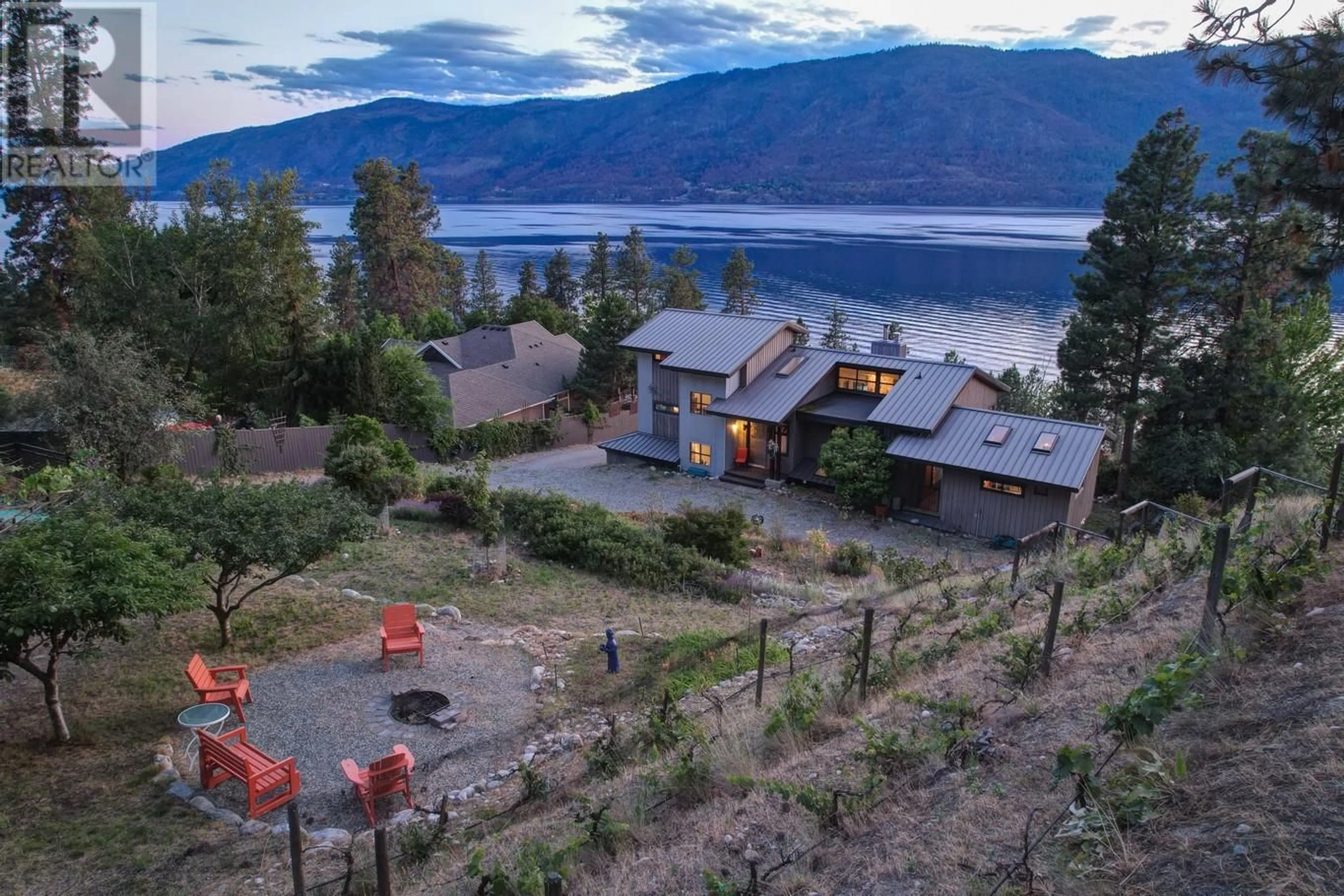 A pic from outside/outdoor area/front of a property/back of a property/a pic from drone, water/lake/river/ocean view for 10145 OKANAGAN CENTRE ROAD WEST, Lake Country British Columbia V4V2J4