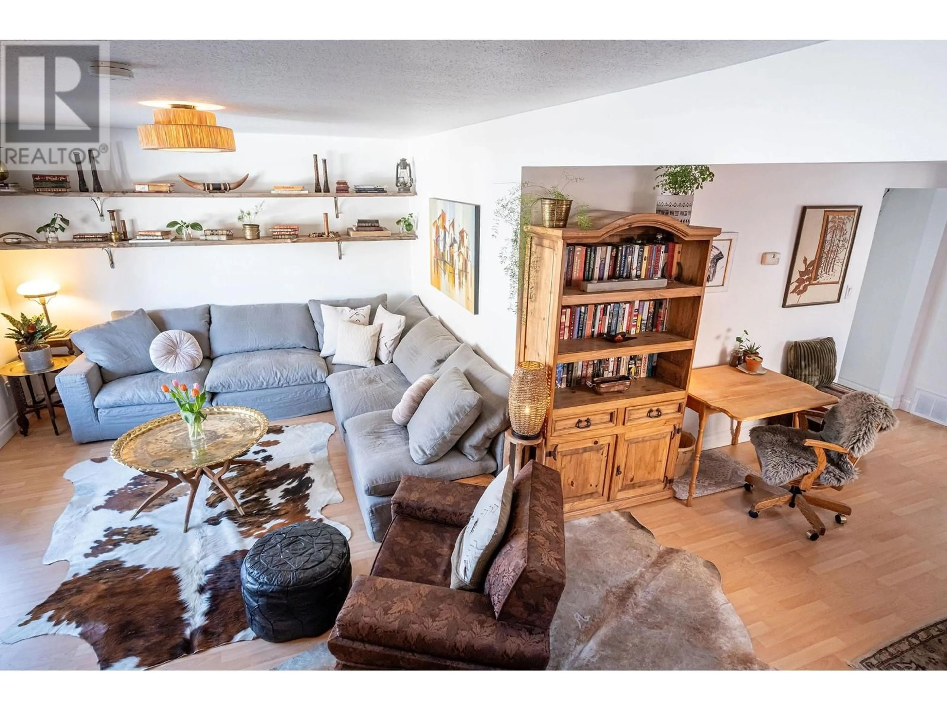 Living room with furniture, wood/laminate floor for 219 Sixth Street E, Revelstoke British Columbia V0E2S0