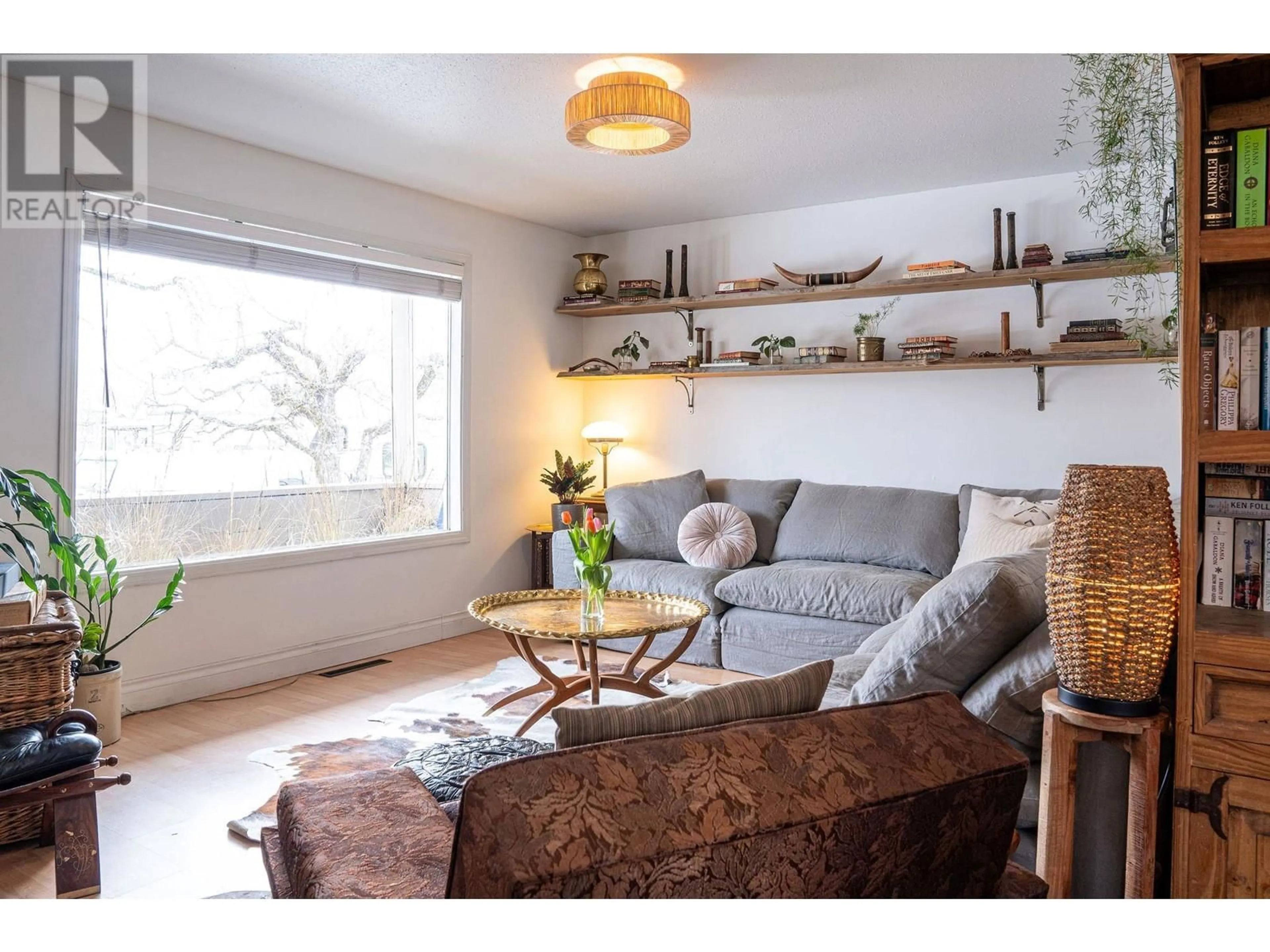 Living room with furniture, wood/laminate floor for 219 Sixth Street E, Revelstoke British Columbia V0E2S0