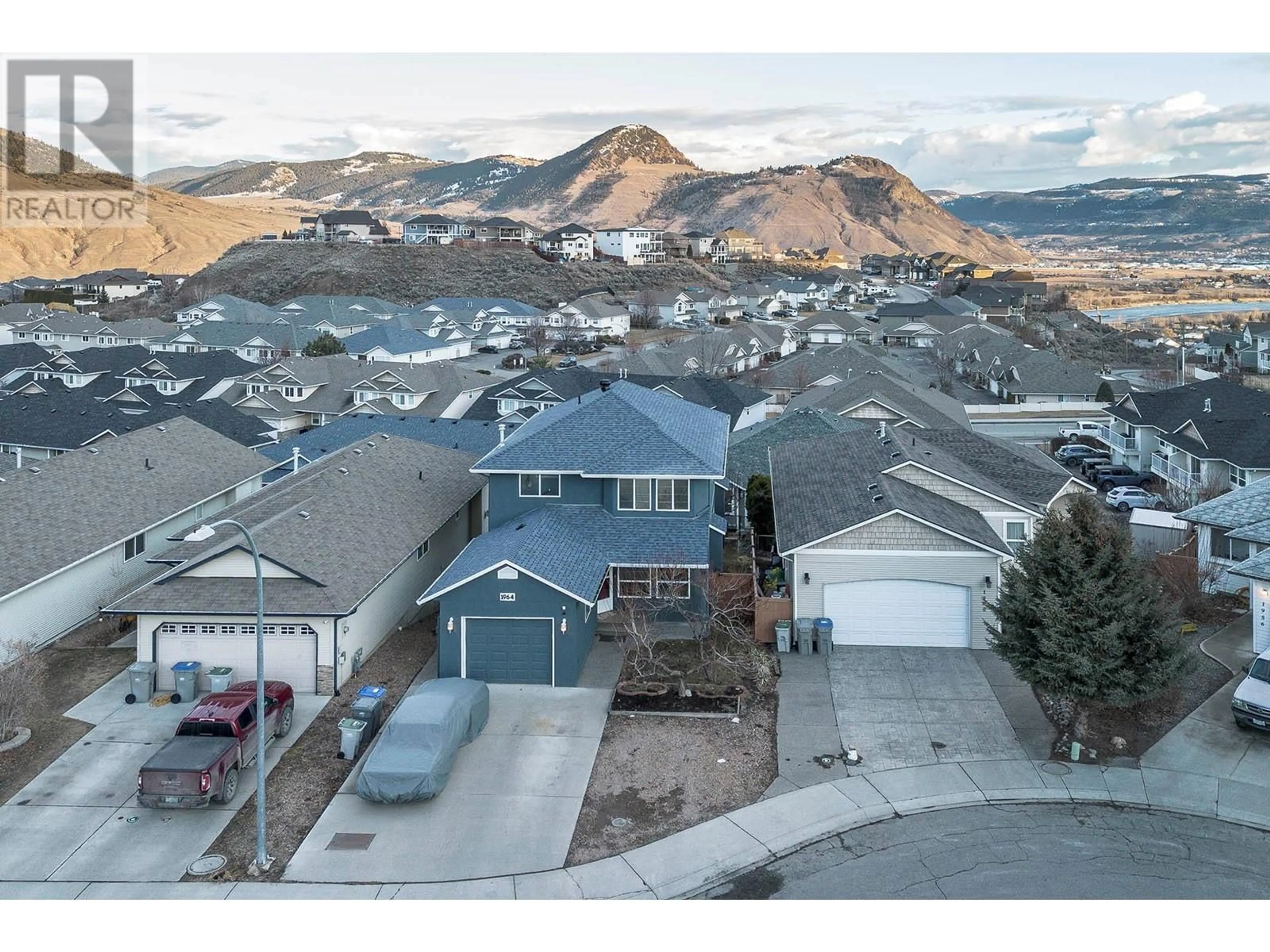 A pic from outside/outdoor area/front of a property/back of a property/a pic from drone, mountain view for 1964 Raven Crescent, Kamloops British Columbia V2B8P5