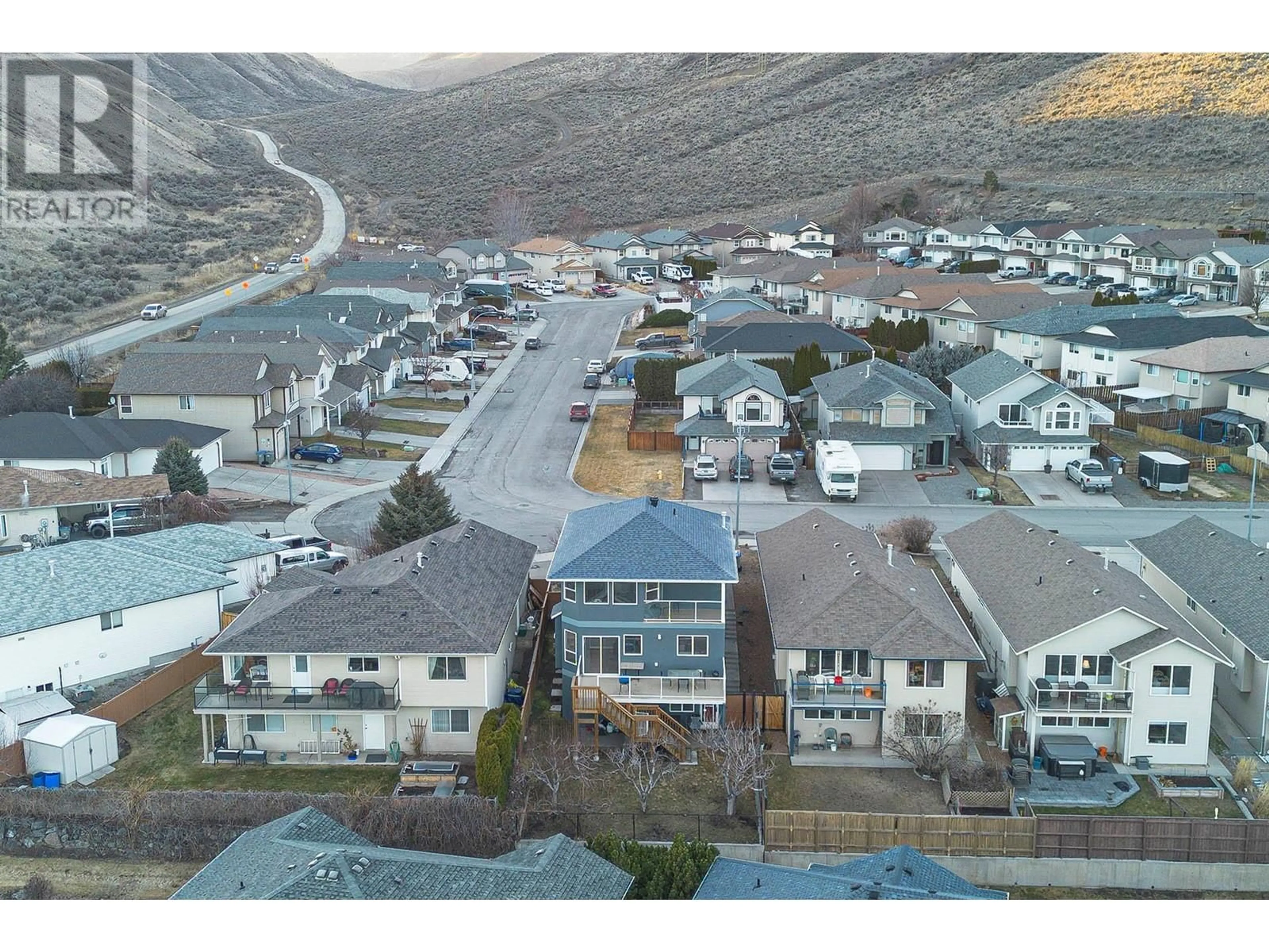 A pic from outside/outdoor area/front of a property/back of a property/a pic from drone, mountain view for 1964 Raven Crescent, Kamloops British Columbia V2B8P5