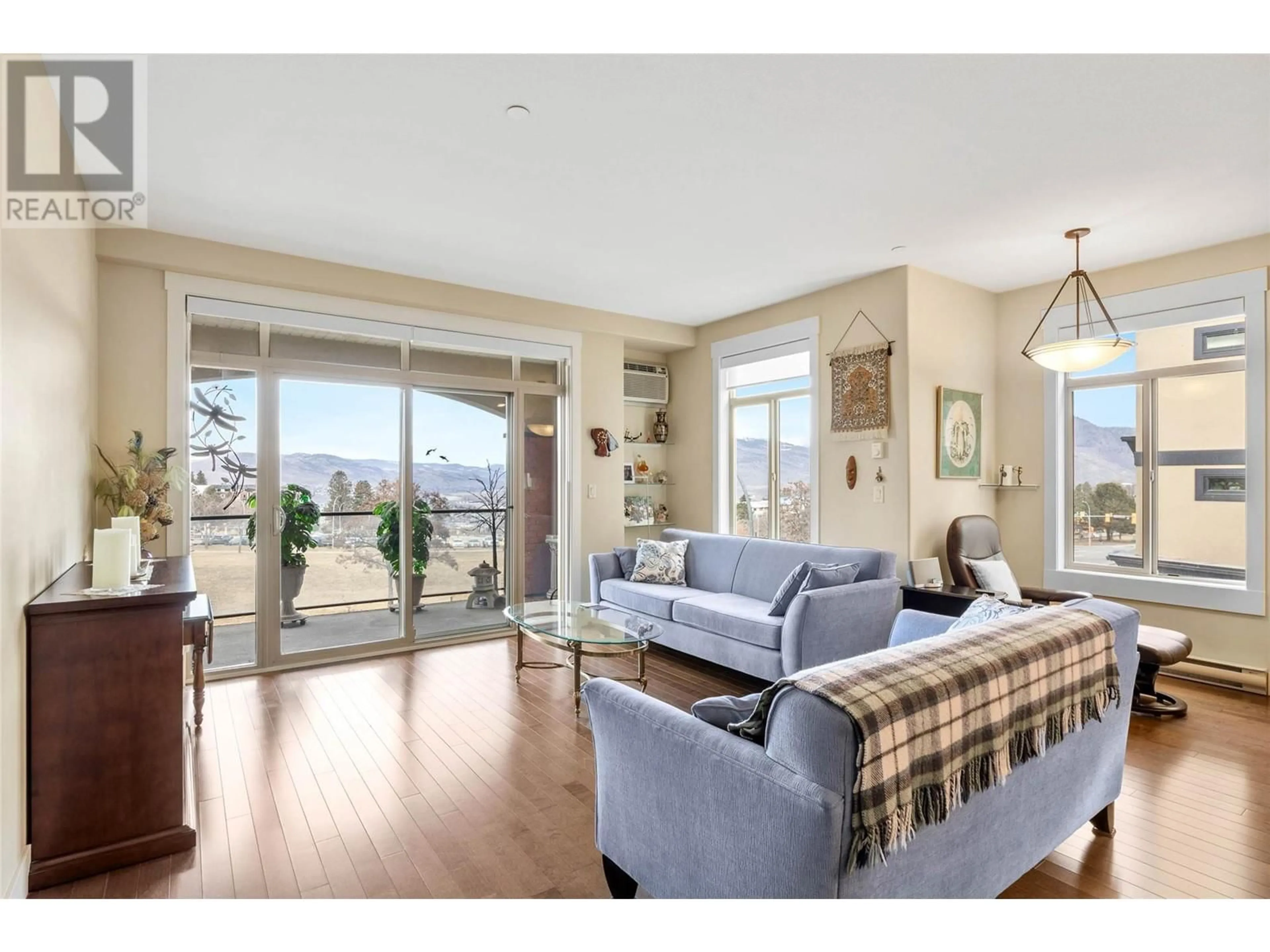 Living room with furniture, wood/laminate floor for 201 - 775 MCGILL ROAD, Kamloops British Columbia V2C0B8