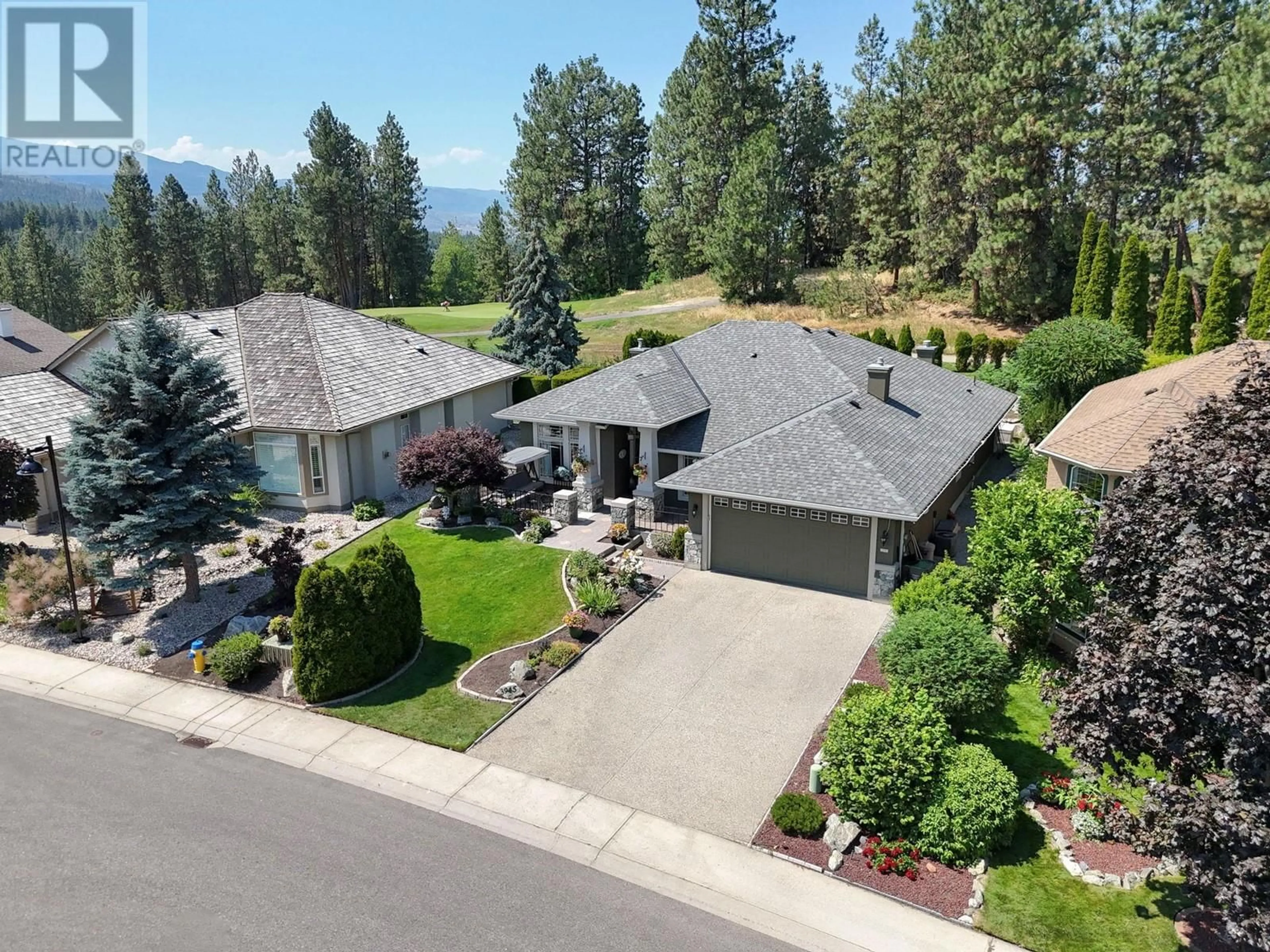 A pic from outside/outdoor area/front of a property/back of a property/a pic from drone, mountain view for 3945 Gallaghers Circle, Kelowna British Columbia V1W3Z9