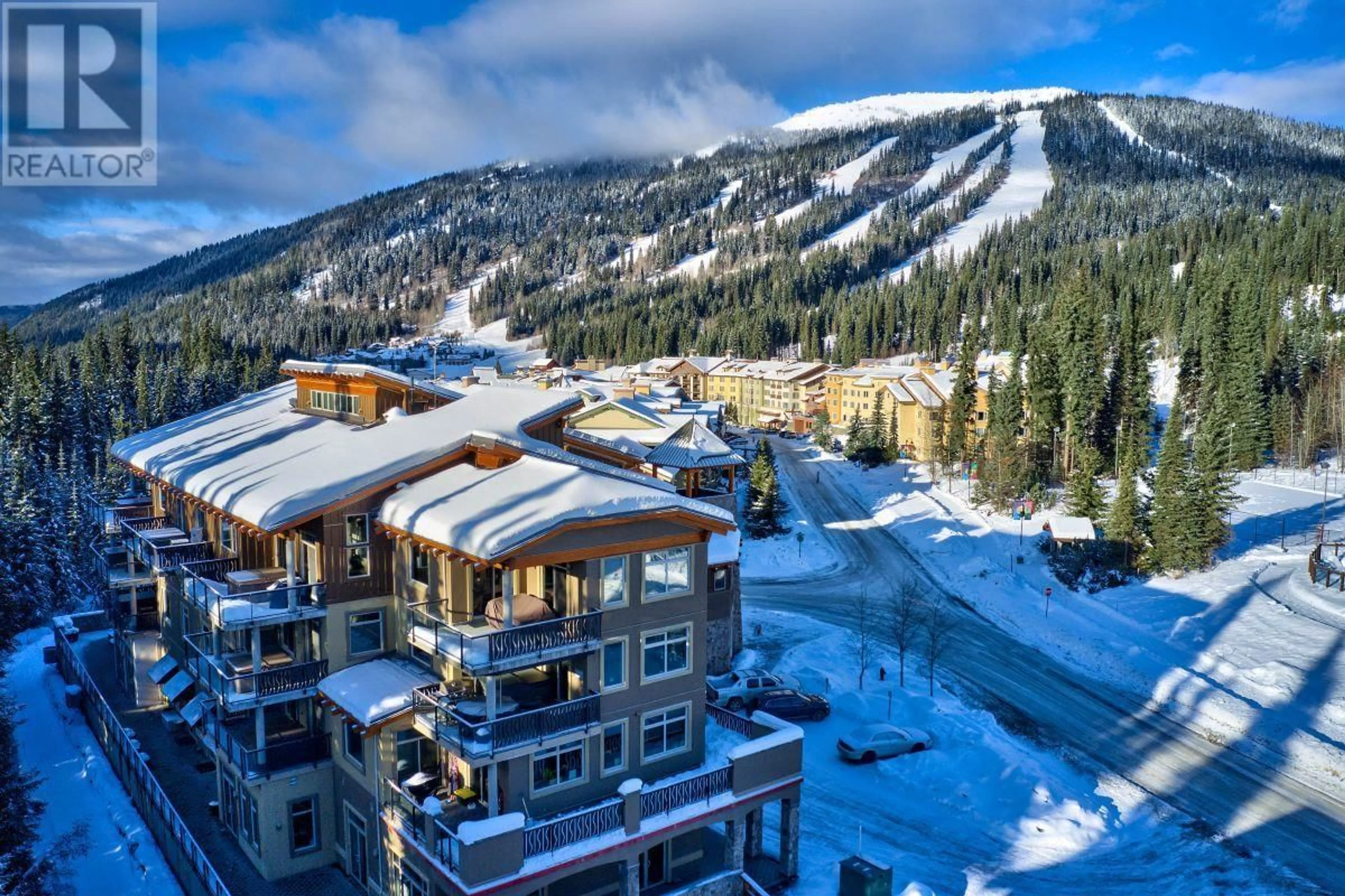 A pic from outside/outdoor area/front of a property/back of a property/a pic from drone, mountain view for 403 - 3270 VILLAGE WAY, Kamloops British Columbia V0E5N0