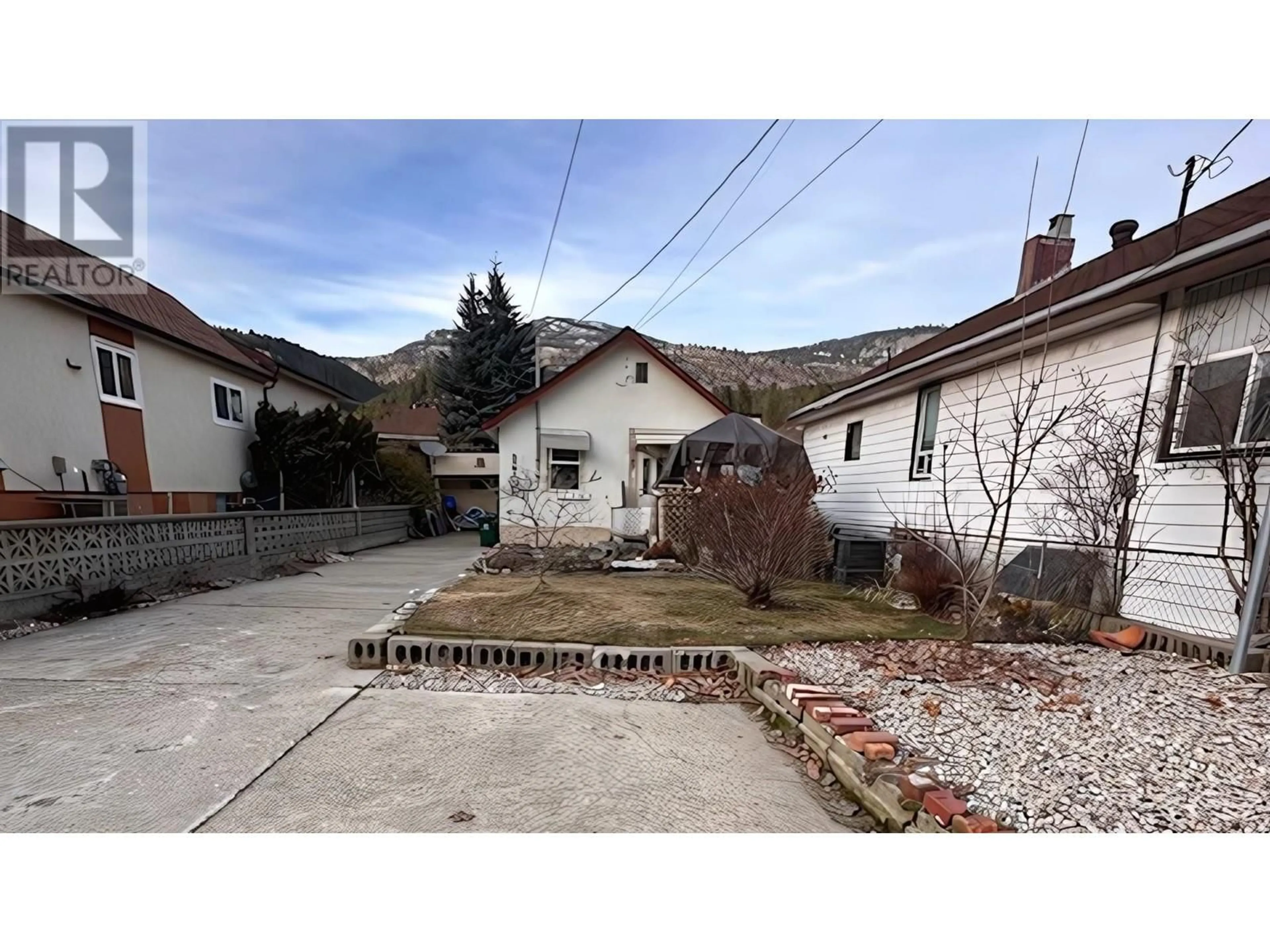 A pic from outside/outdoor area/front of a property/back of a property/a pic from drone, street for 1863 THIRD AVENUE, Trail British Columbia V1R1R2