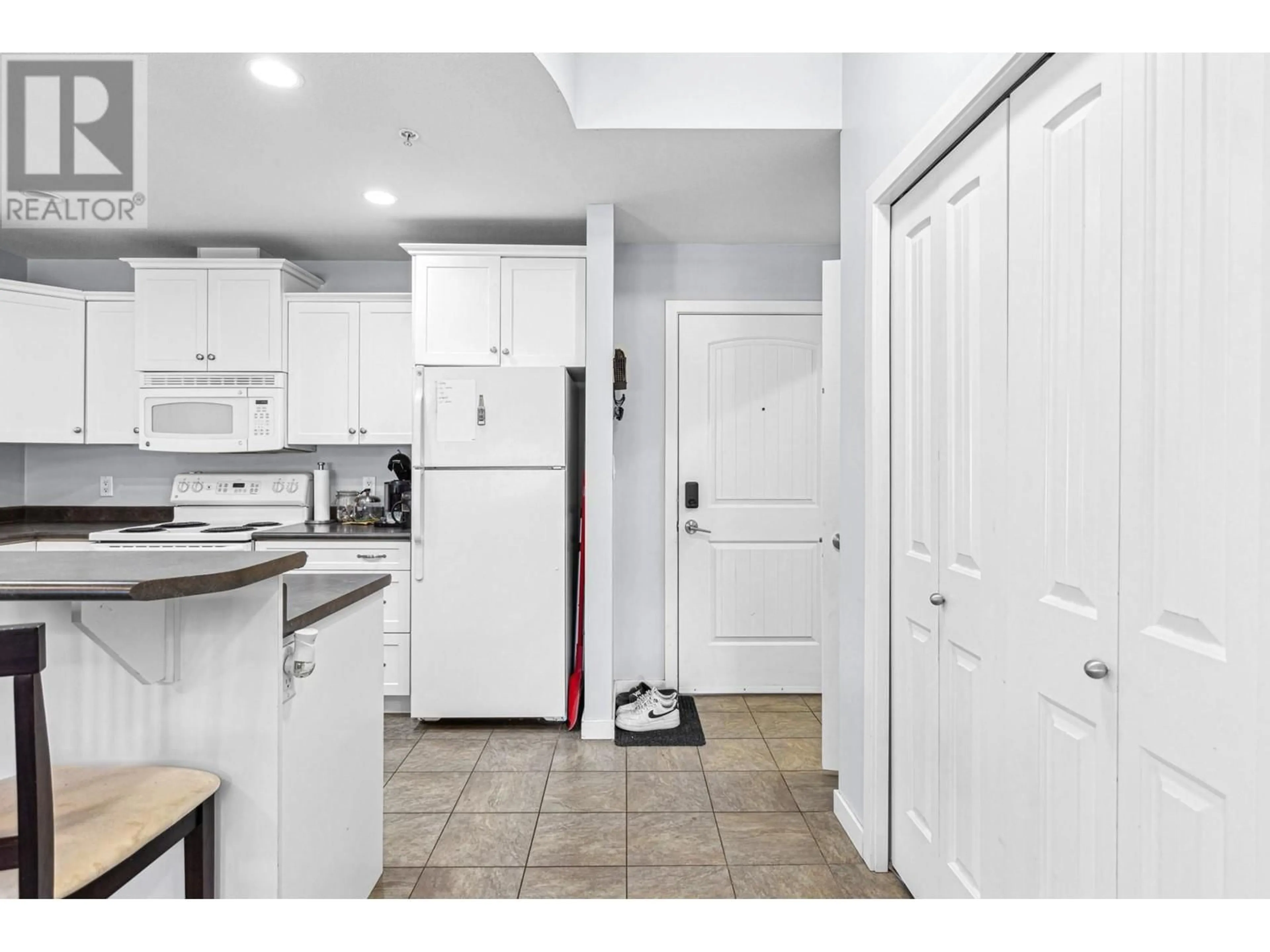 Standard kitchen, ceramic/tile floor for 210 - 345 MILLS ROAD, Kelowna British Columbia V1X4G9