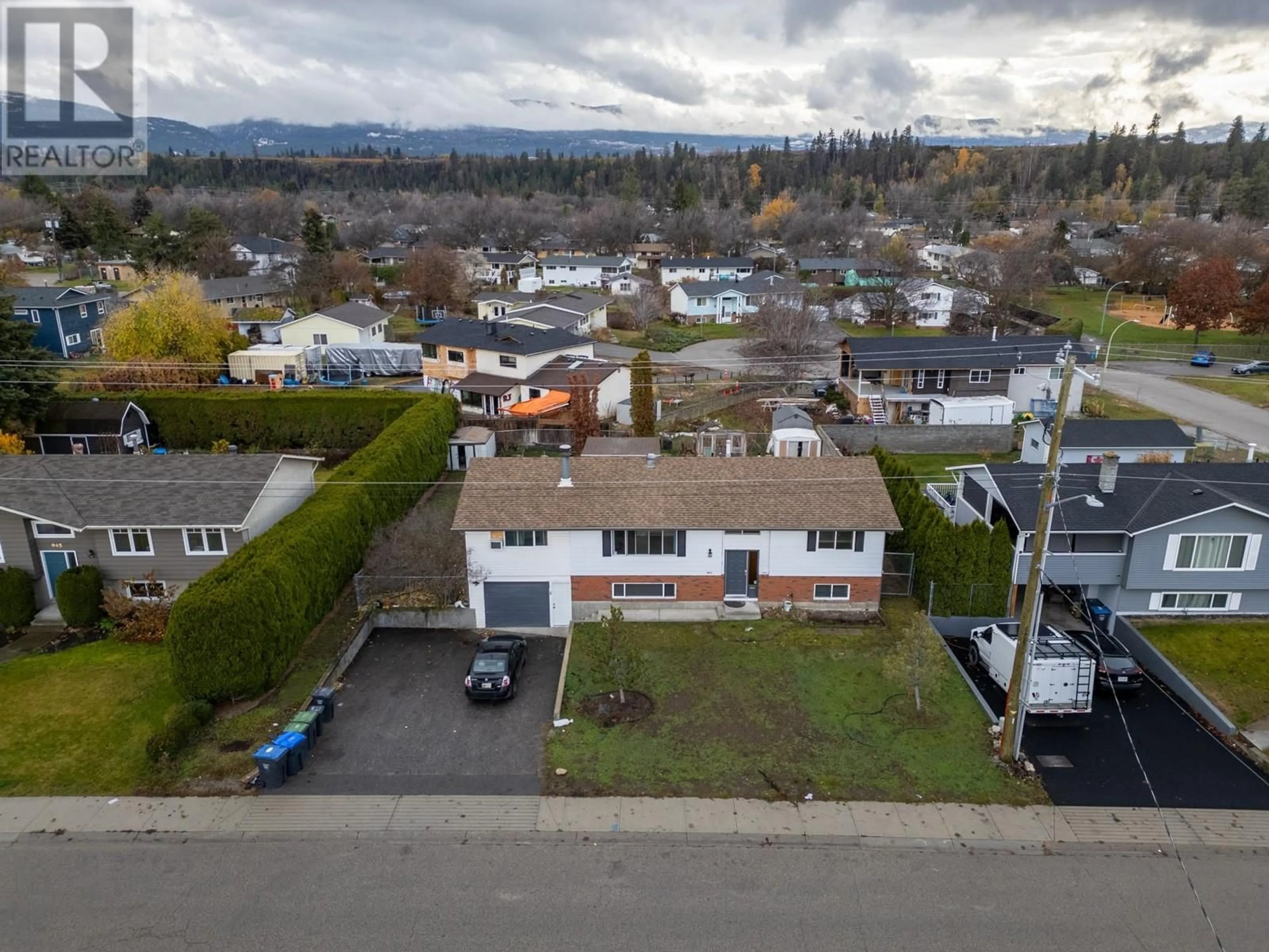 A pic from outside/outdoor area/front of a property/back of a property/a pic from drone, street for 965 Graham Road, Kelowna British Columbia V1X5X4