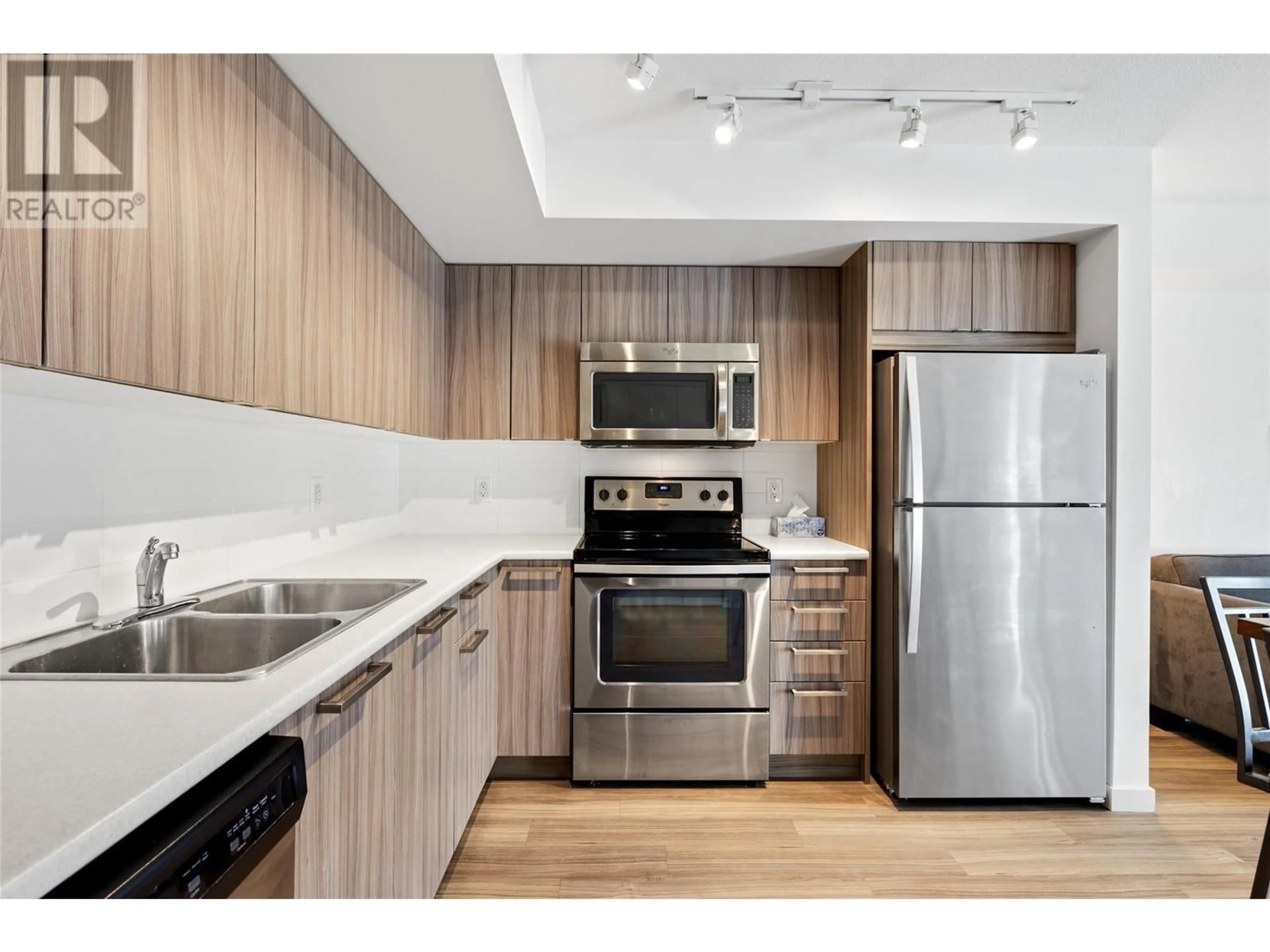Standard kitchen, wood/laminate floor for 111 - 883 ACADEMY WAY, Kelowna British Columbia V1V0A3