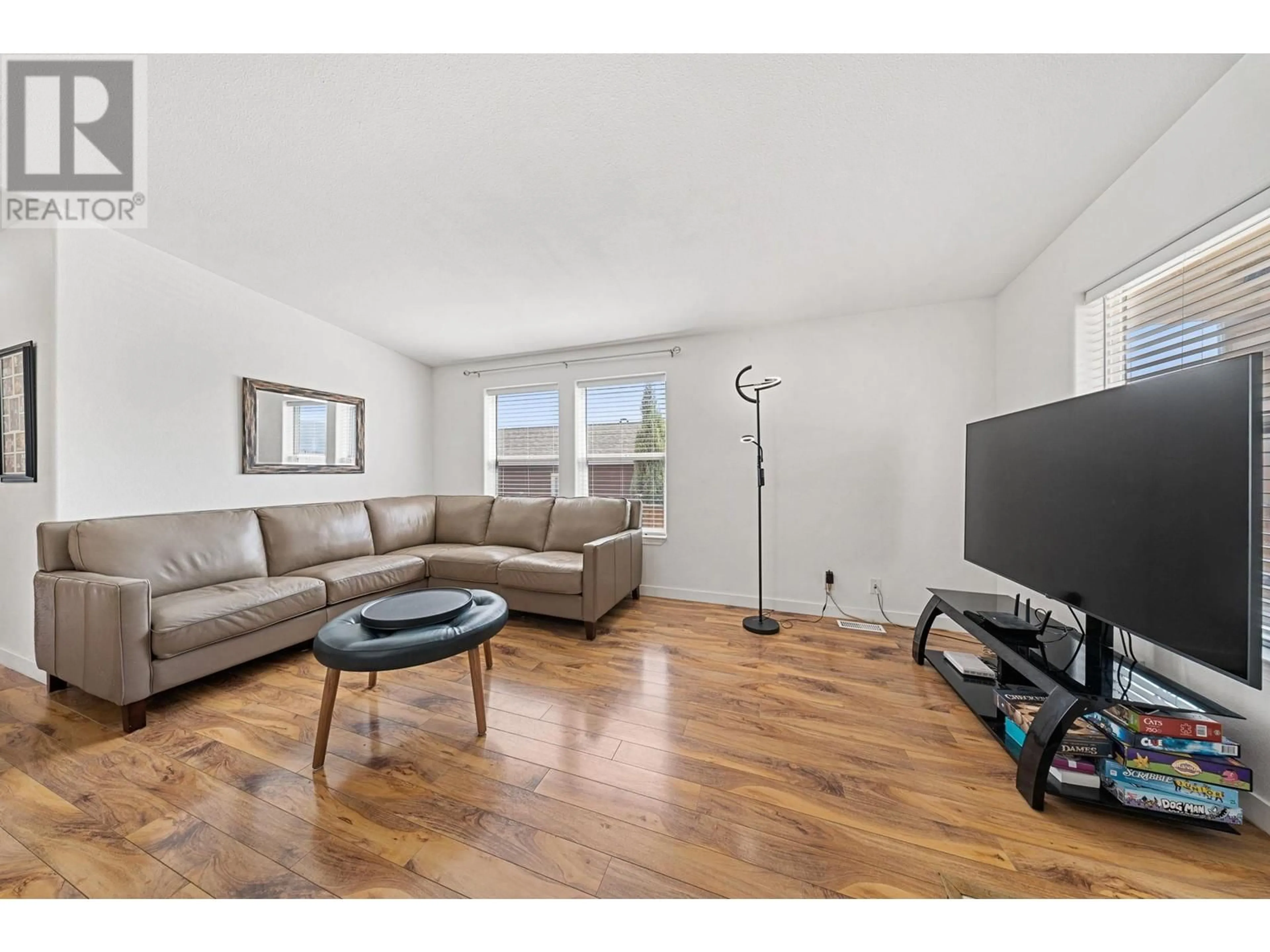 Living room with furniture, wood/laminate floor for 606 - 2440 OLD OKANAGAN HIGHWAY, West Kelowna British Columbia V4T3A3