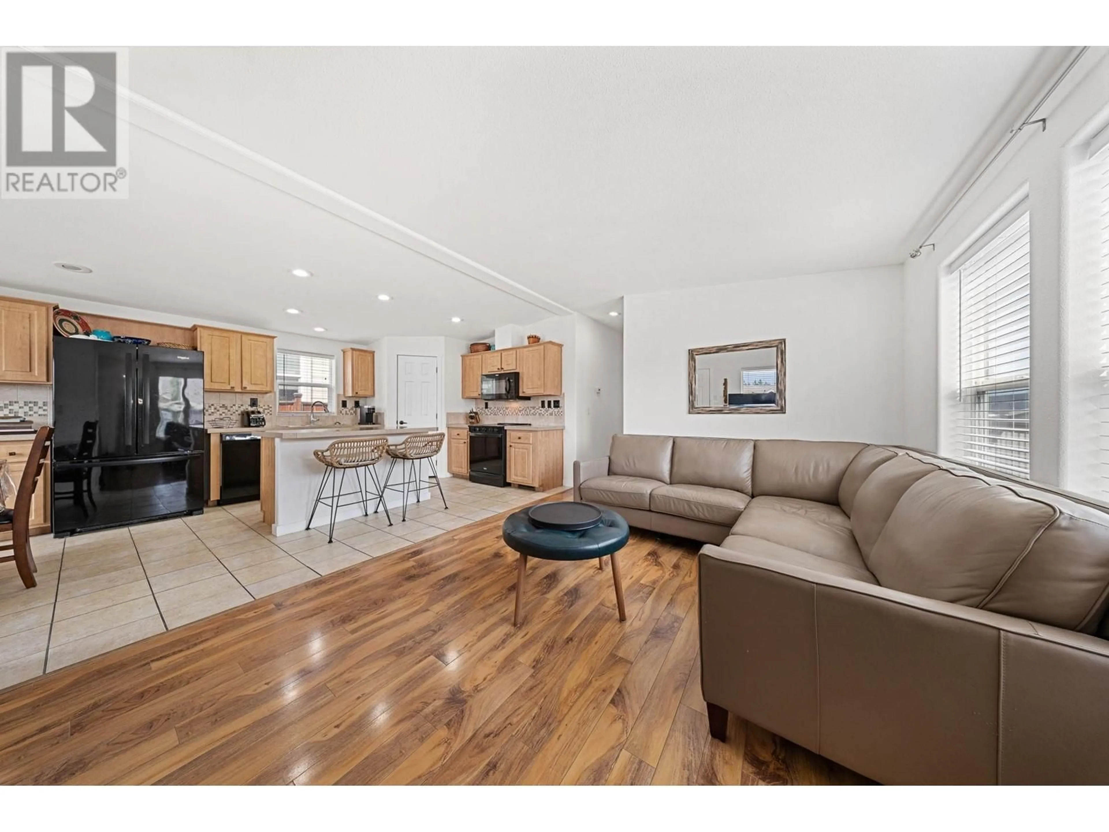 Living room with furniture, wood/laminate floor for 606 - 2440 OLD OKANAGAN HIGHWAY, West Kelowna British Columbia V4T3A3
