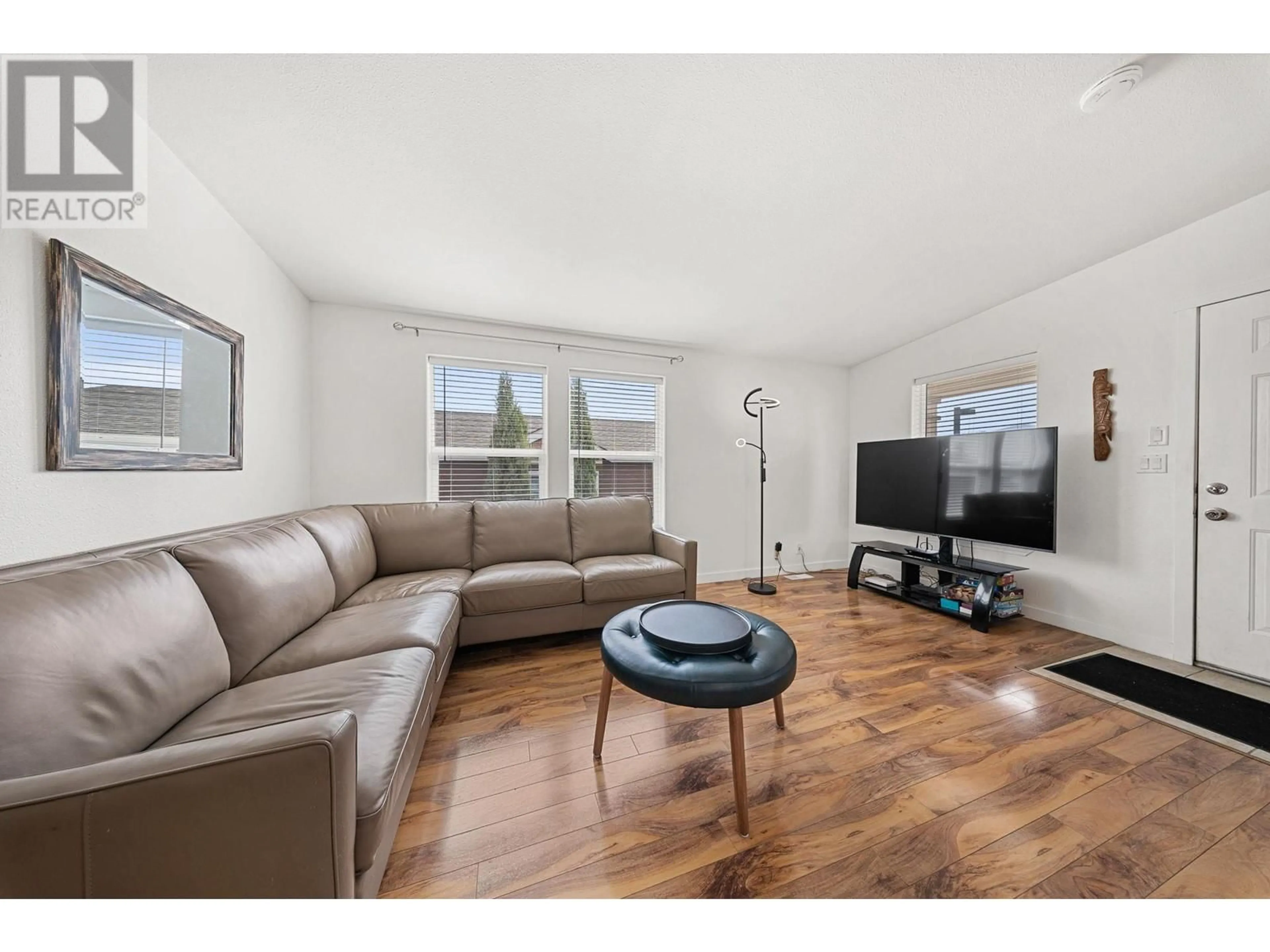 Living room with furniture, wood/laminate floor for 606 - 2440 OLD OKANAGAN HIGHWAY, West Kelowna British Columbia V4T3A3