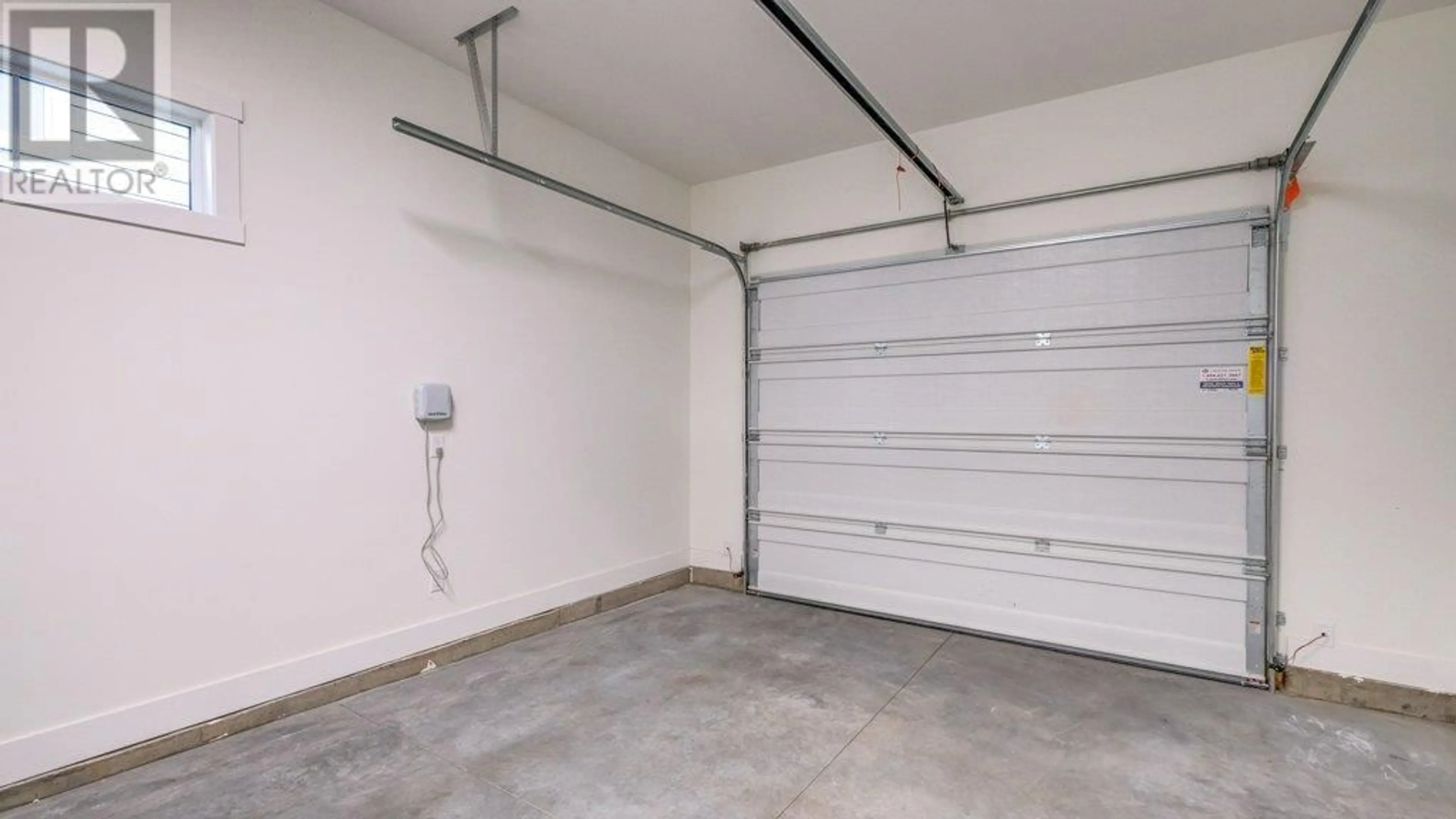 Indoor garage for 1428 Tower Ranch Drive, Kelowna British Columbia V1P1T8