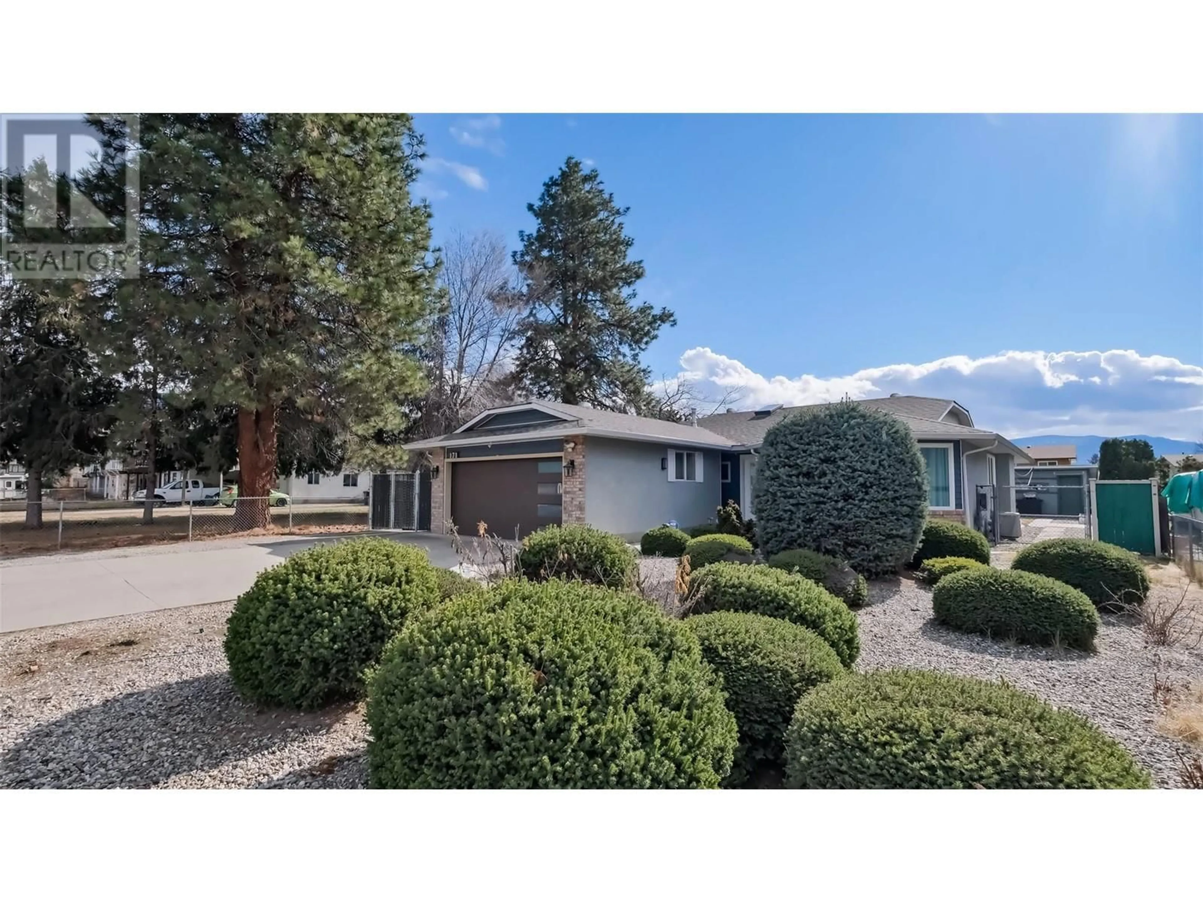 A pic from outside/outdoor area/front of a property/back of a property/a pic from drone, street for 171 MCCURDY ROAD, Kelowna British Columbia V1X2P1