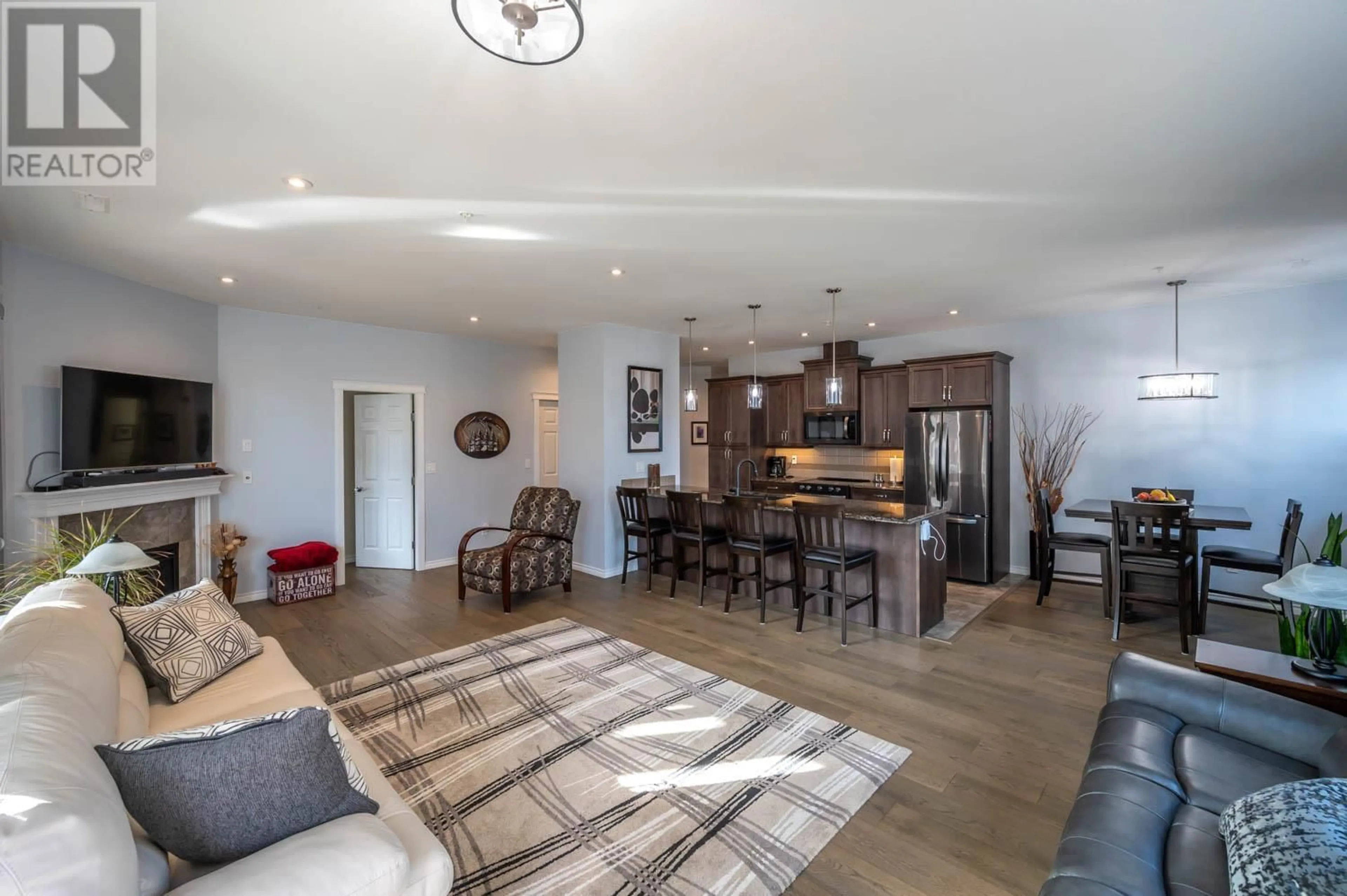 Open concept kitchen, wood/laminate floor for 901 - 3388 SKAHA LAKE ROAD, Penticton British Columbia V2A6G4