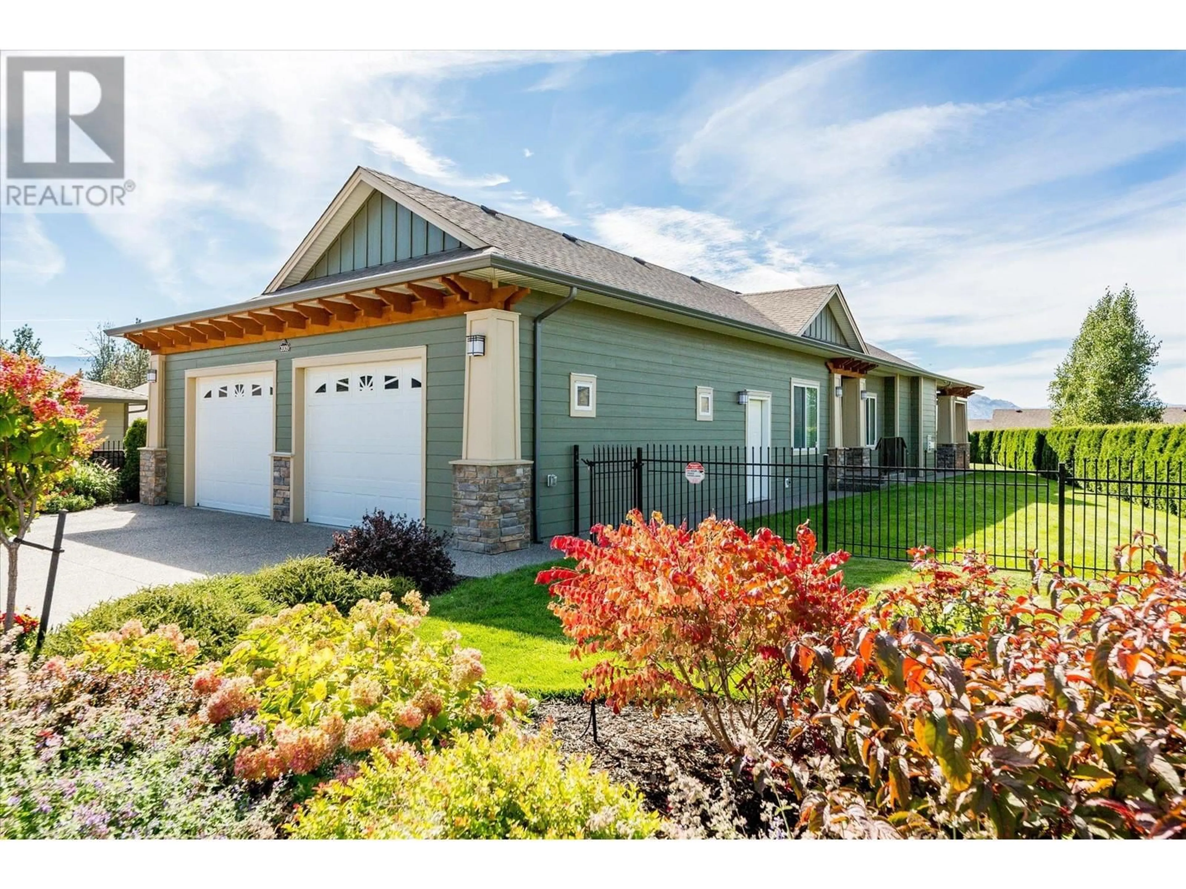 Home with vinyl exterior material, street for 2009 CAROLINE WAY, Westbank British Columbia V4T0A9