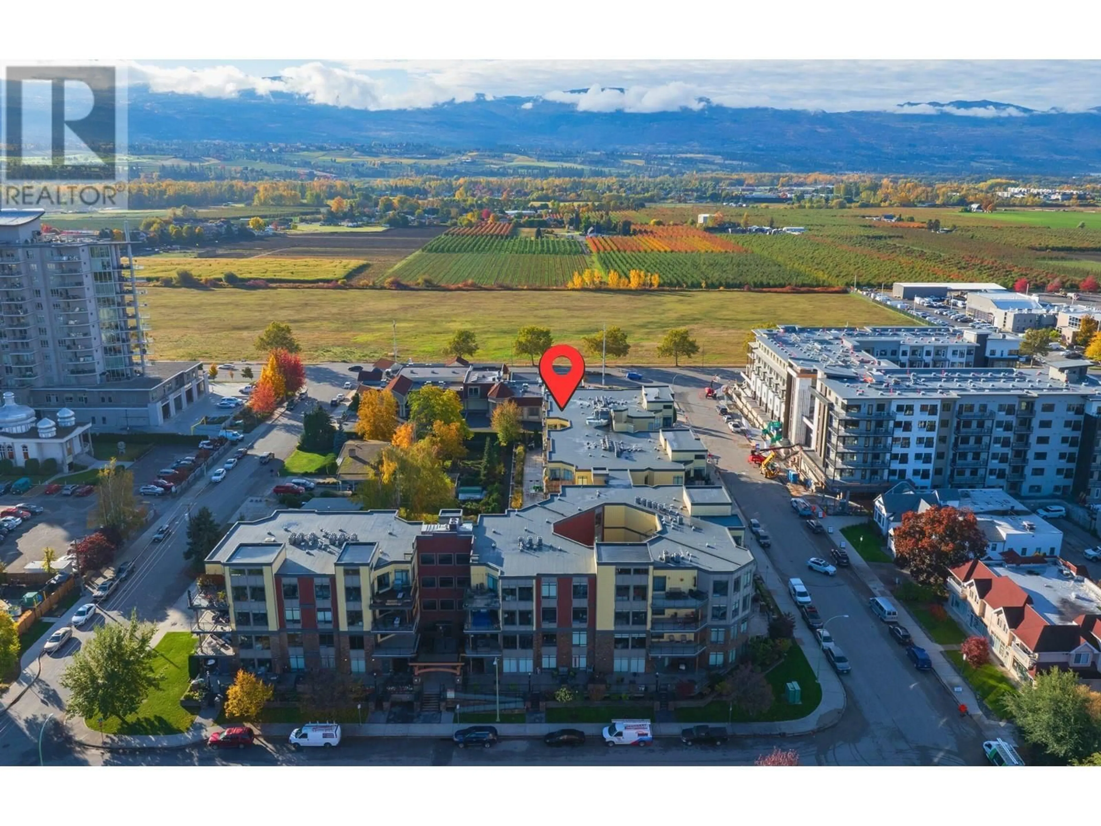 A pic from outside/outdoor area/front of a property/back of a property/a pic from drone, mountain view for 1933 Ambrosi Road Unit# 406, Kelowna British Columbia V1Y4S1