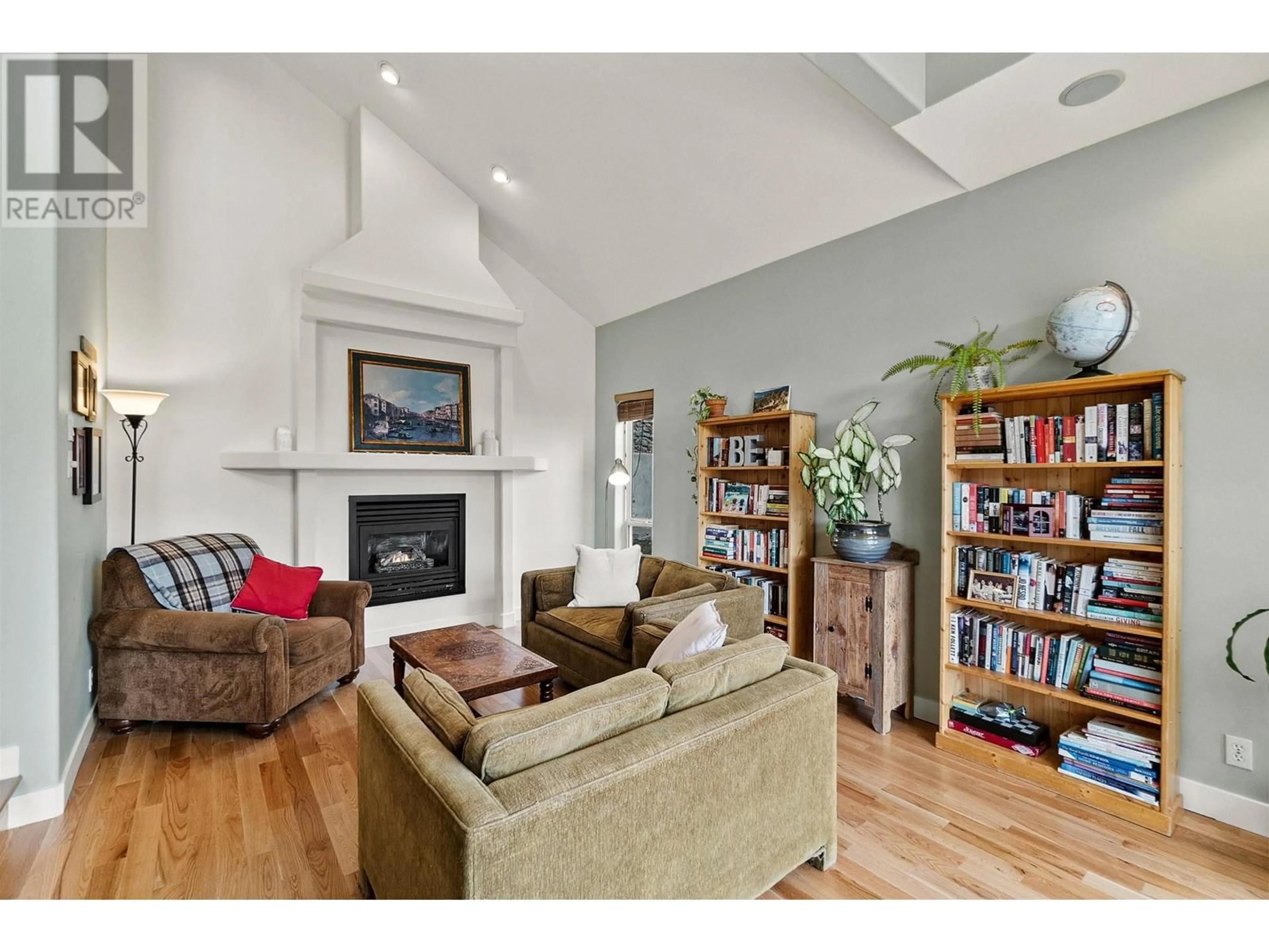 Living room with furniture, wood/laminate floor for 712 Creekside Road, Penticton British Columbia V2A2C4