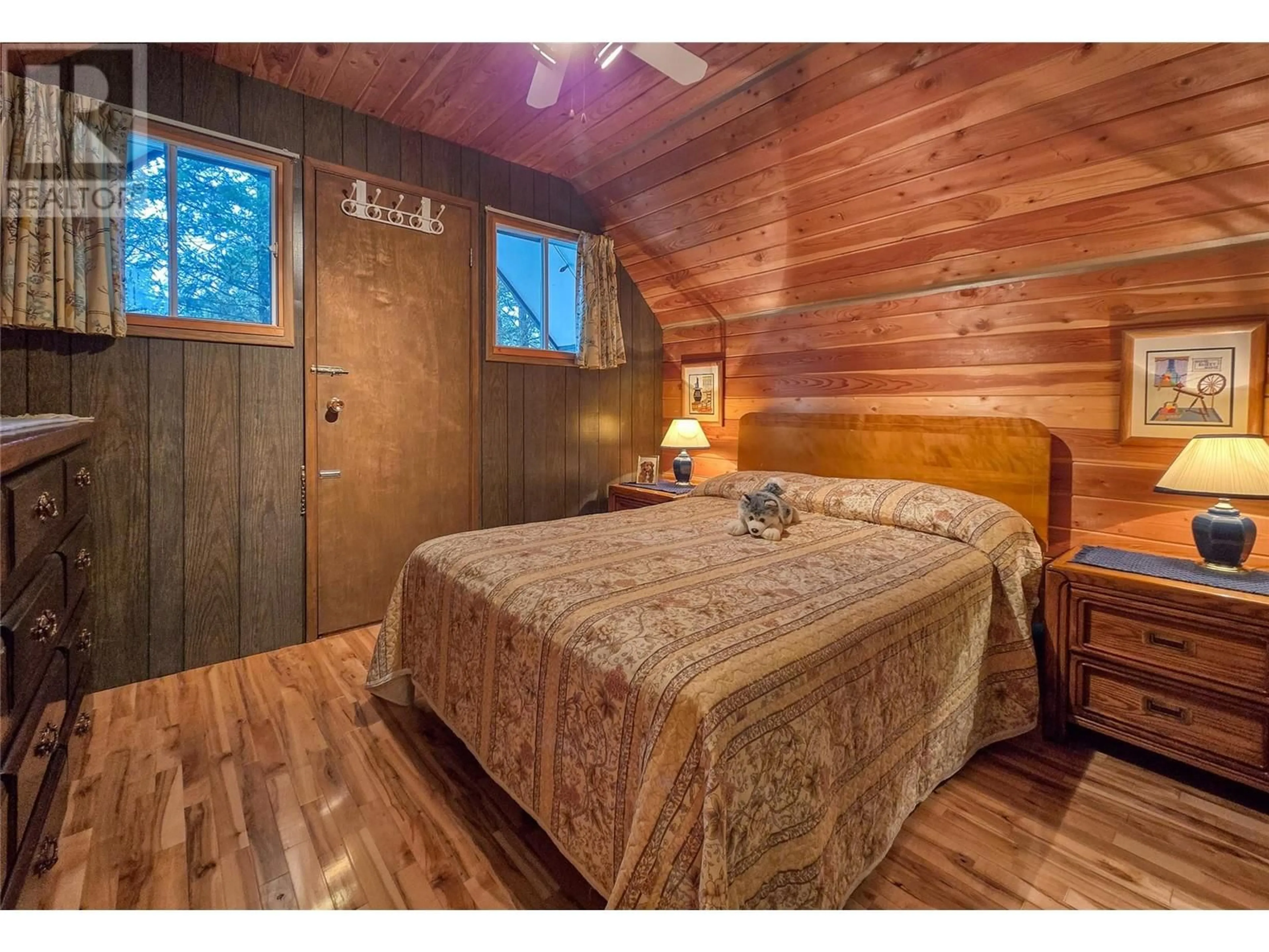 Bedroom with bed, wood/laminate floor for 4362 Szabo Road, Spur Valley British Columbia V0A1E0