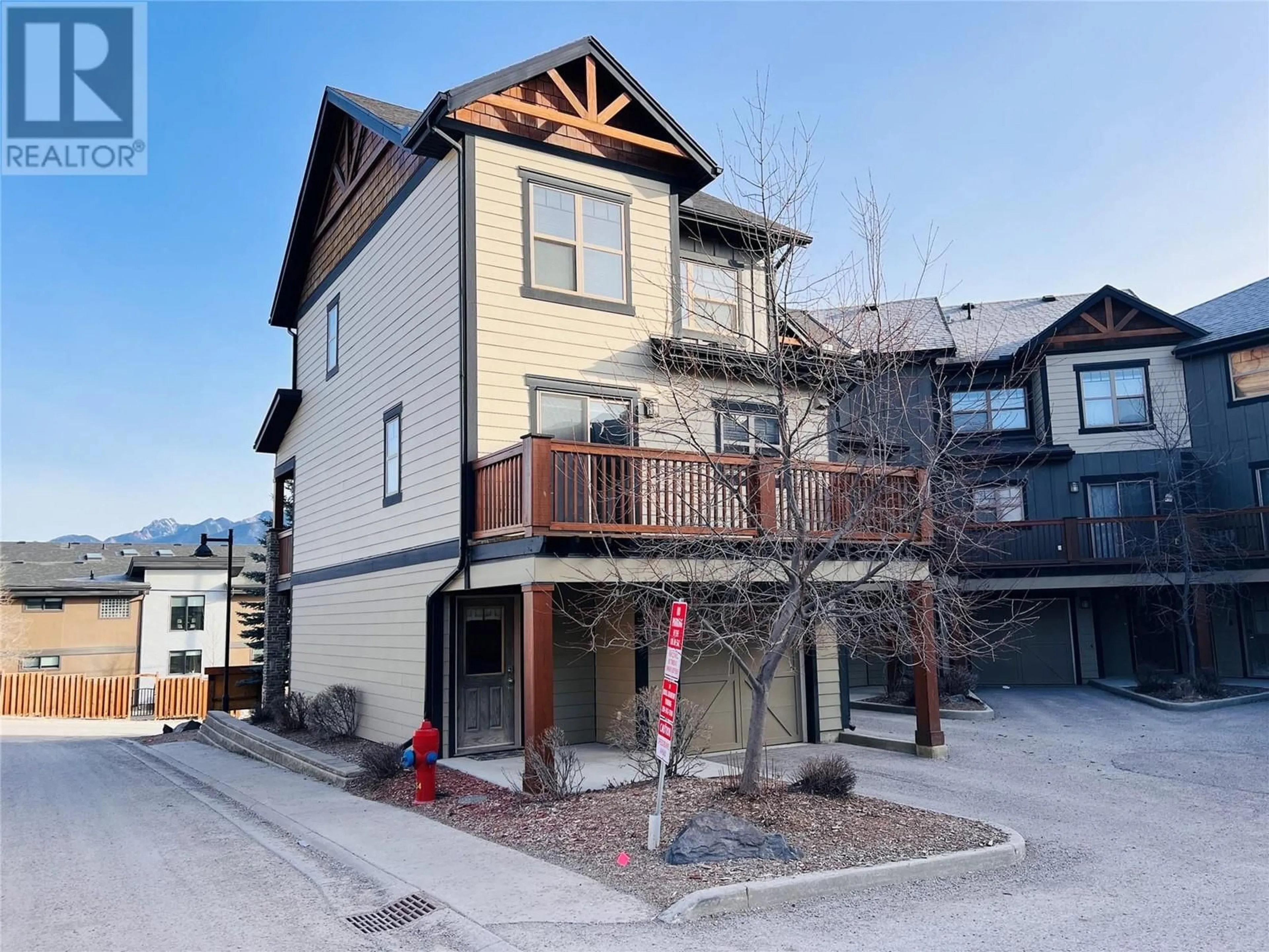 A pic from outside/outdoor area/front of a property/back of a property/a pic from drone, unknown for 1000 9TH Street Unit# 1, Invermere British Columbia V0A1K0