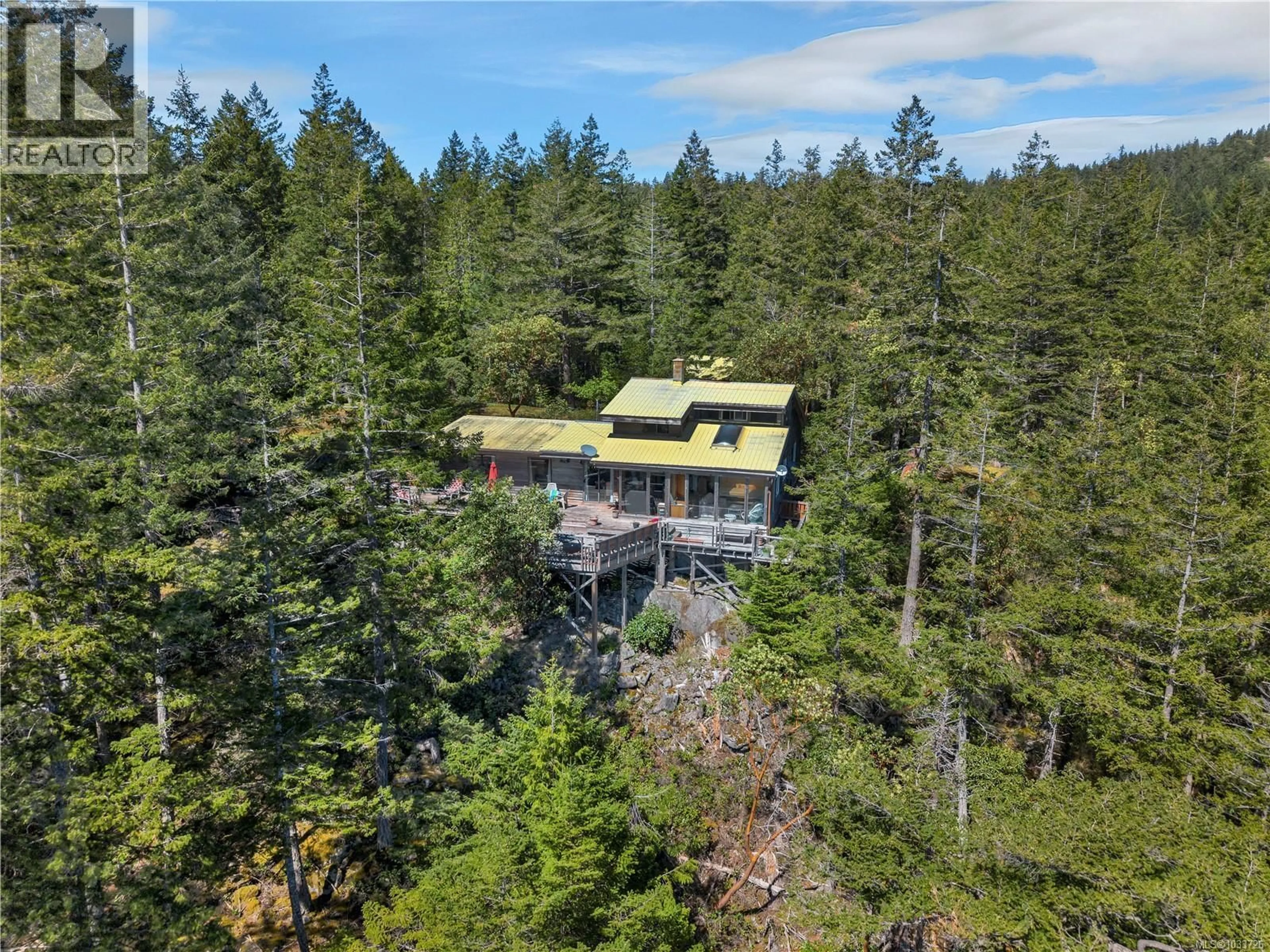 A pic from outside/outdoor area/front of a property/back of a property/a pic from drone, forest/trees view for 1395 MANZANITA ROAD, Cortes Island British Columbia V0P1K0