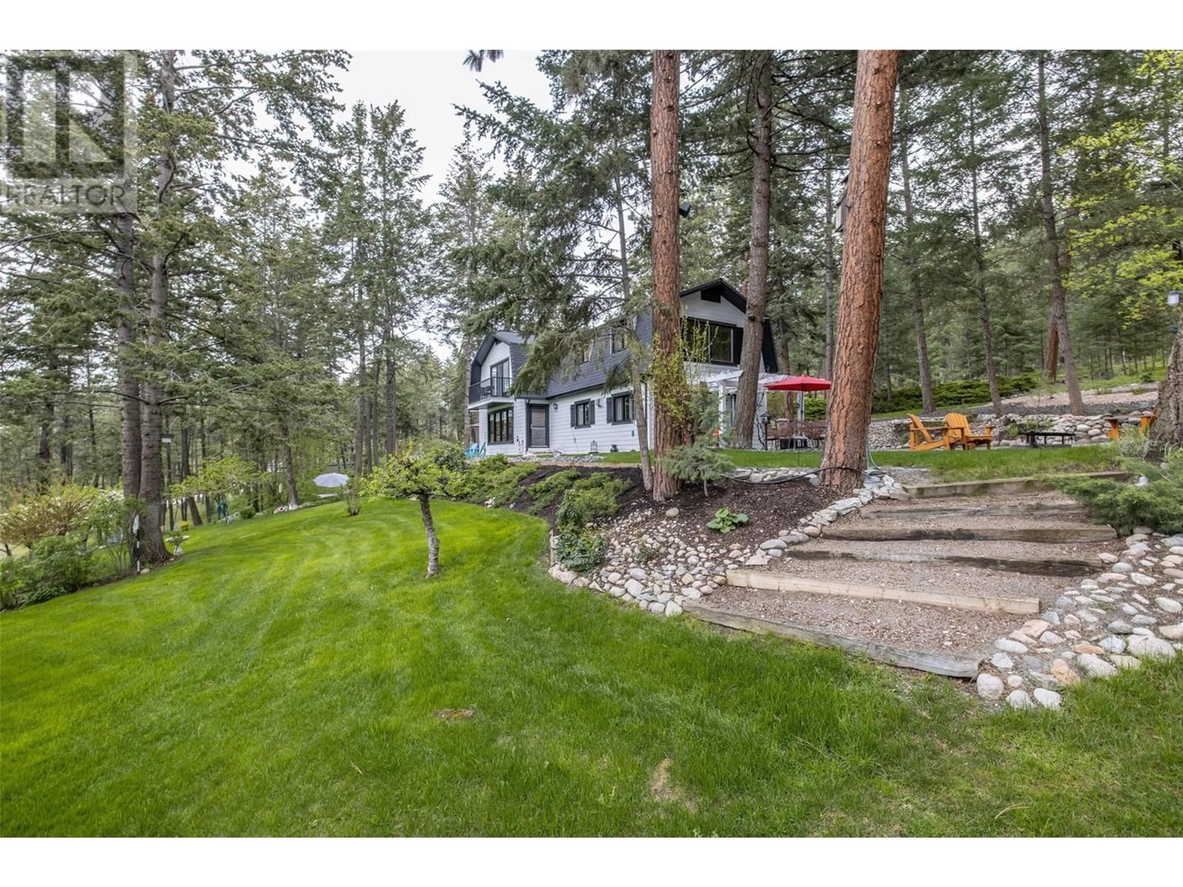 A pic from outside/outdoor area/front of a property/back of a property/a pic from drone, forest/trees view for 16550 BARKLEY ROAD, Lake Country British Columbia V4V1B5