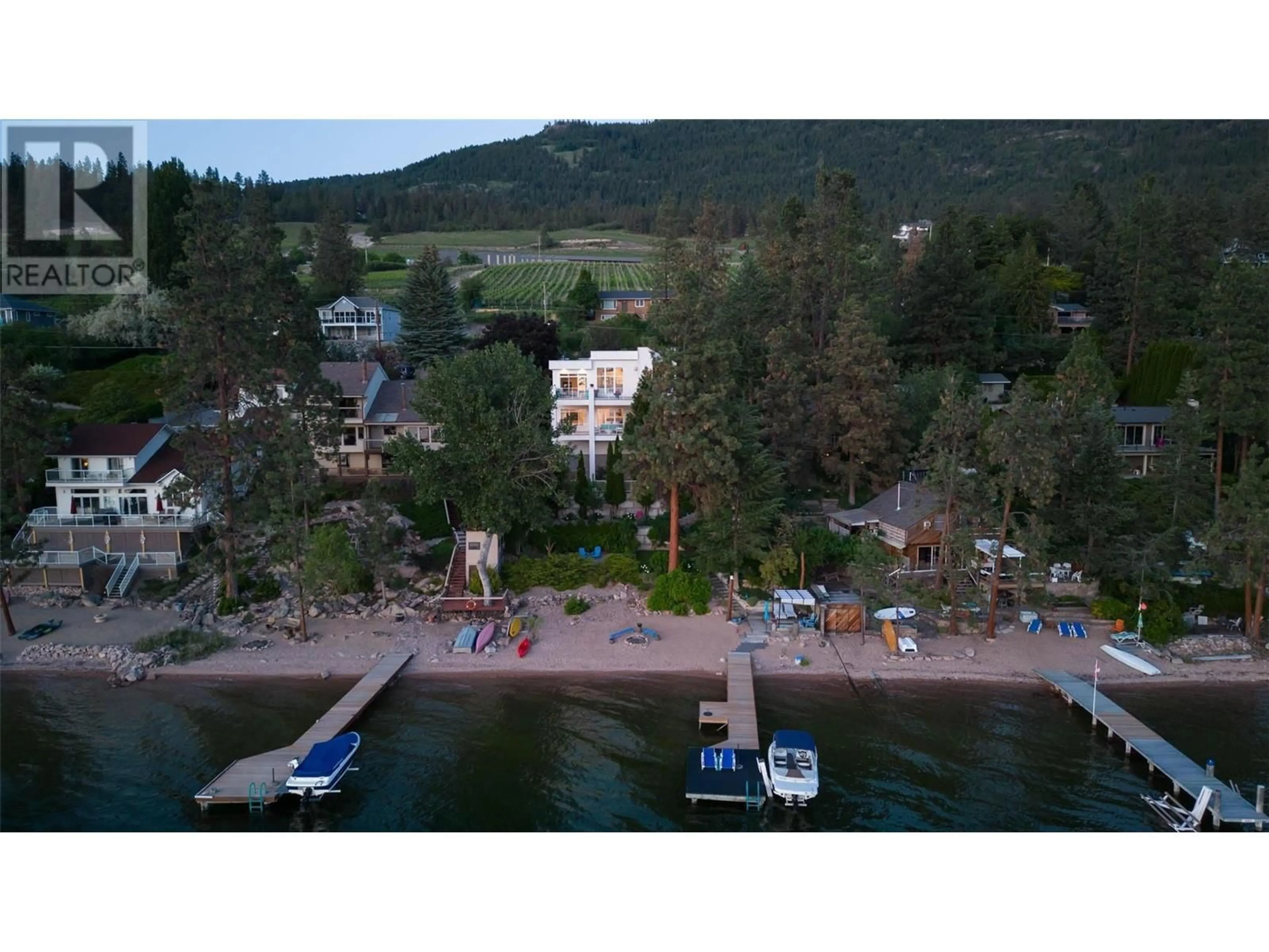 A pic from outside/outdoor area/front of a property/back of a property/a pic from drone, water/lake/river/ocean view for 16980 Coral Beach Road, Lake Country British Columbia V4V1B9