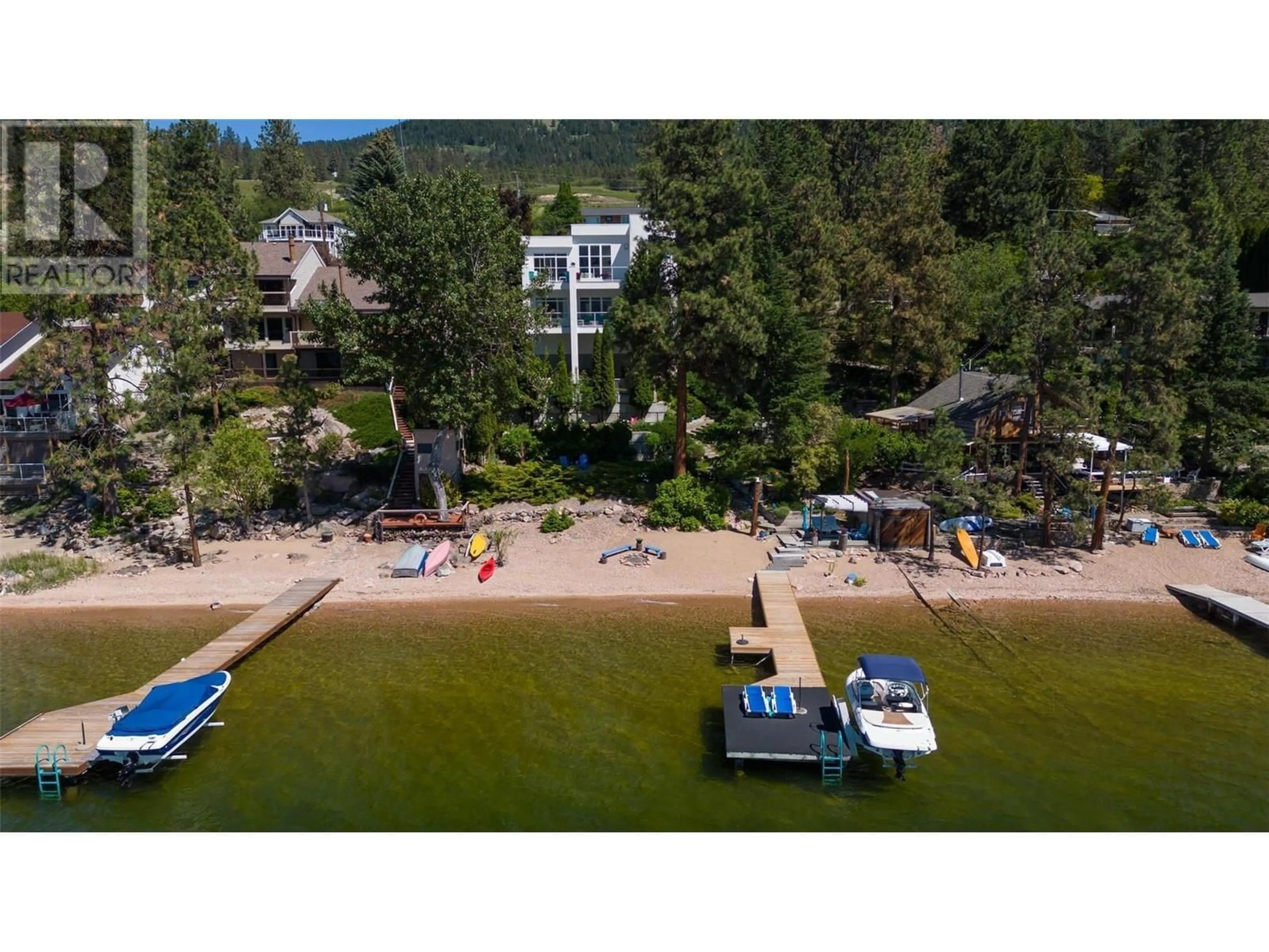 A pic from outside/outdoor area/front of a property/back of a property/a pic from drone, water/lake/river/ocean view for 16980 Coral Beach Road, Lake Country British Columbia V4V1B9