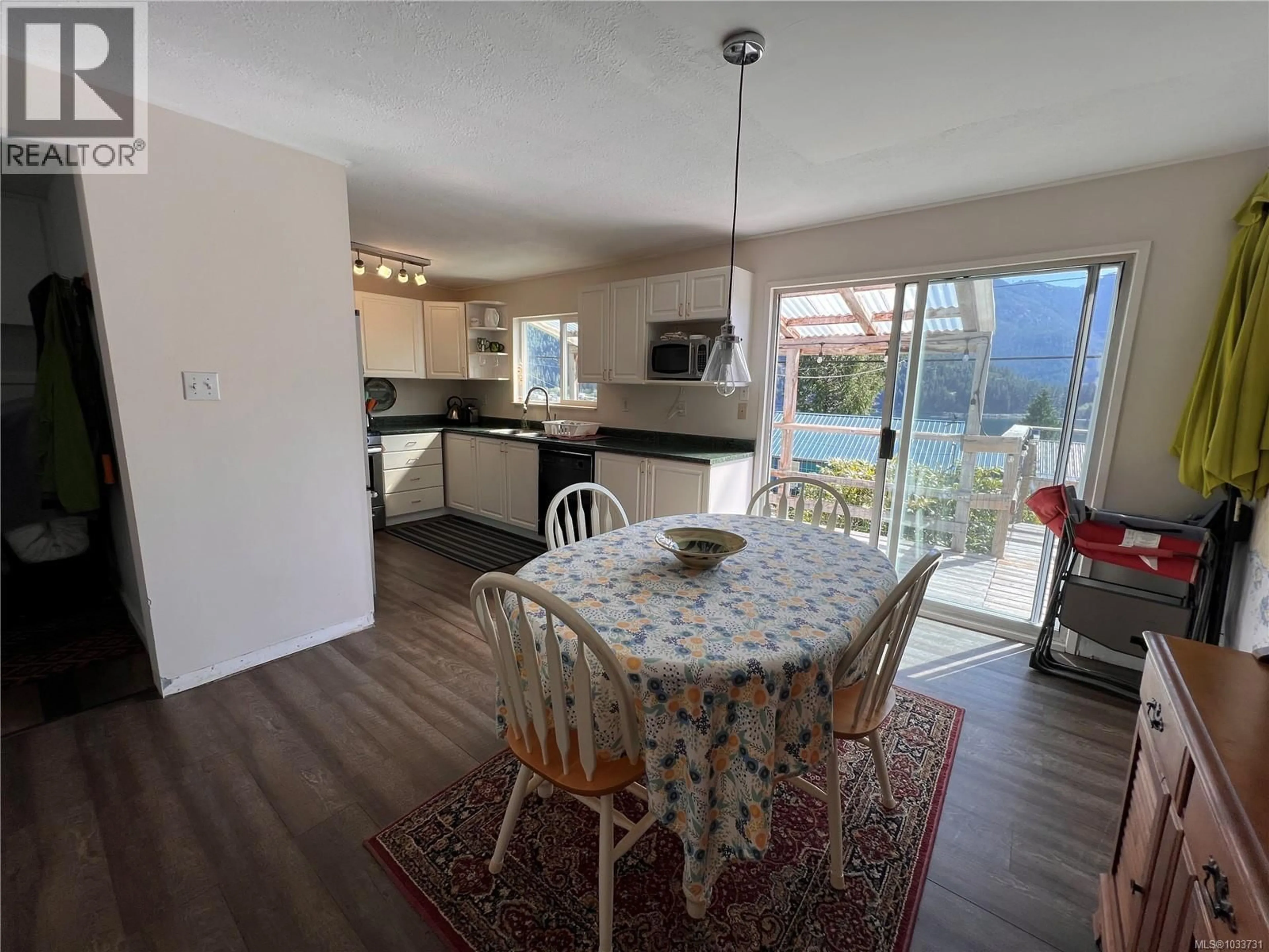 Dining room, wood/laminate floor for 580 CARDIAC CLIMB, Tahsis British Columbia V0R1X0