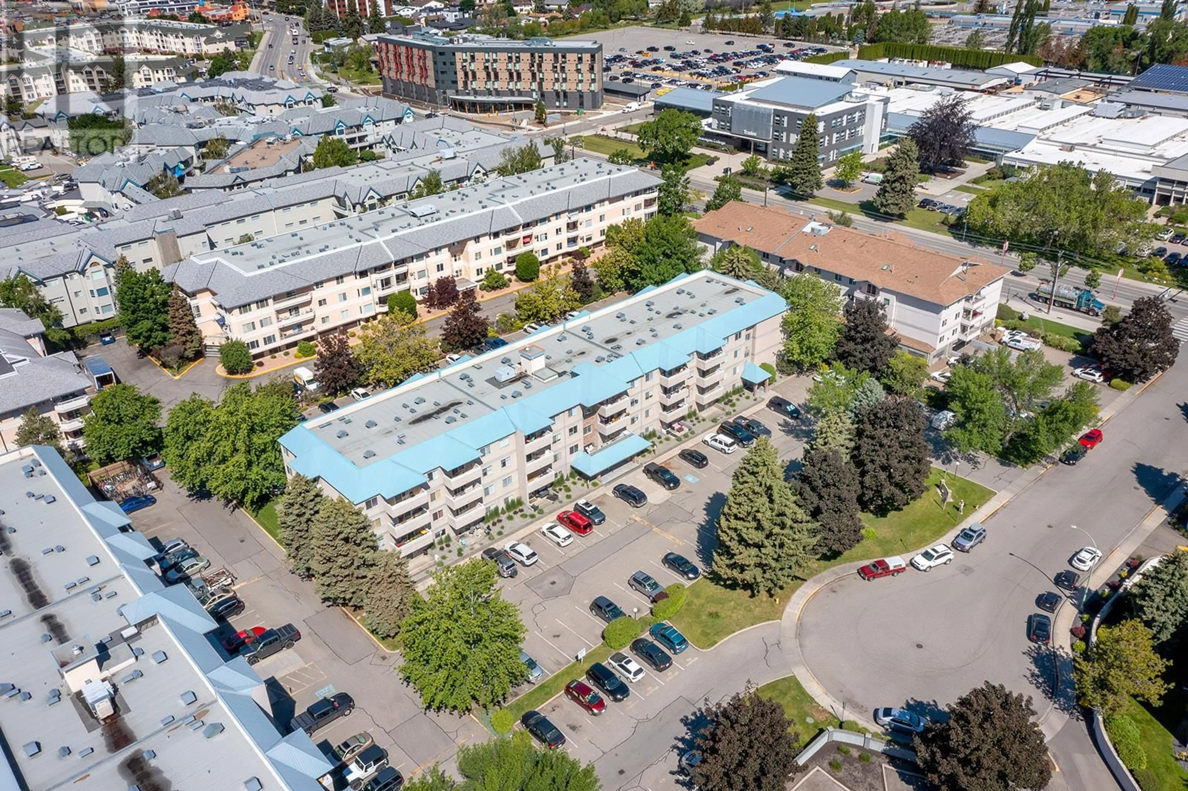 A pic from outside/outdoor area/front of a property/back of a property/a pic from drone, city buildings view from balcony for 3160 De Montreuil Court Unit# 208, Kelowna British Columbia V1W3W3