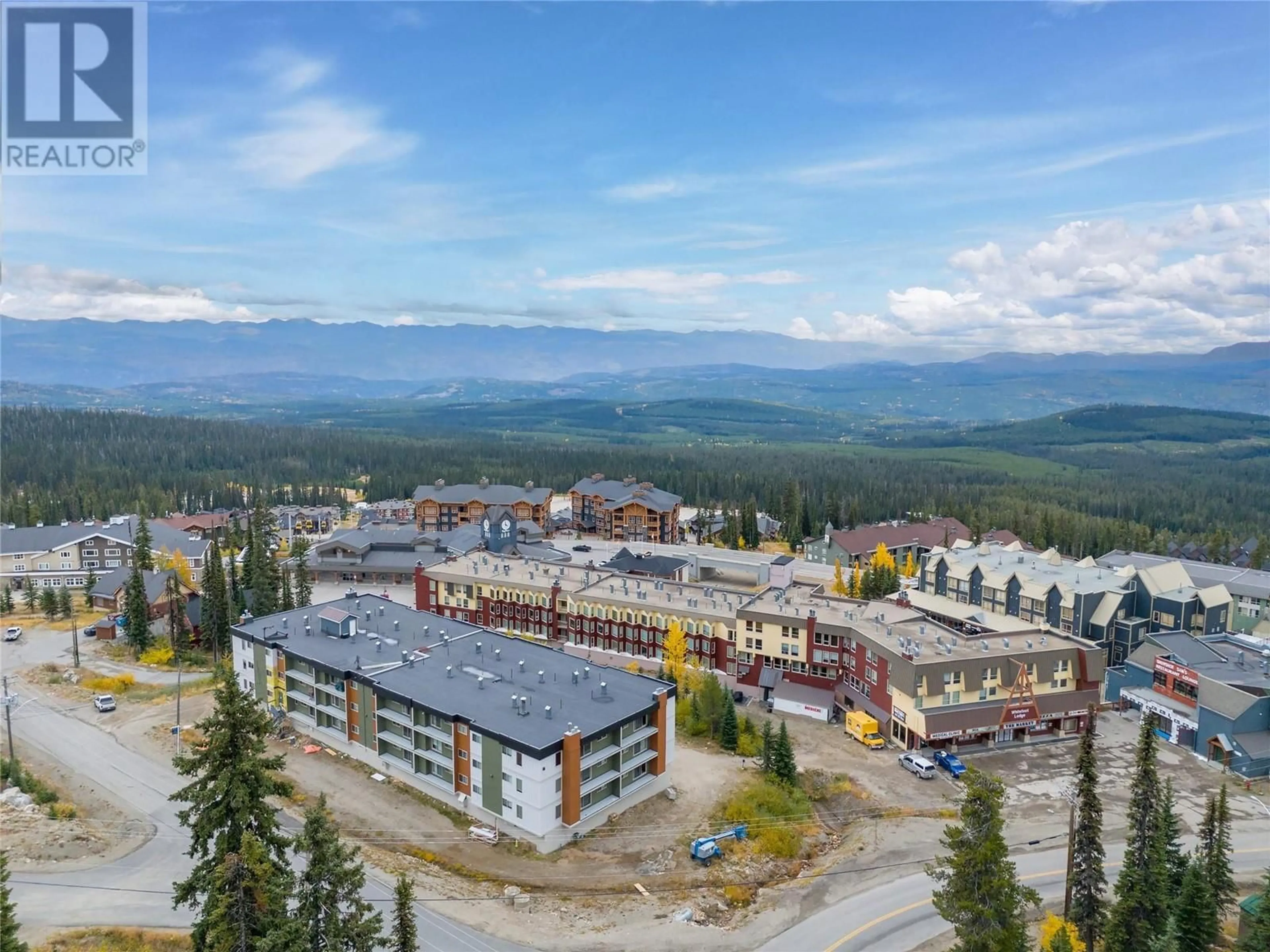 A pic from outside/outdoor area/front of a property/back of a property/a pic from drone, mountain view for 110 - 6430 WHISKEY JACK ROAD, Big White British Columbia V1P1P3