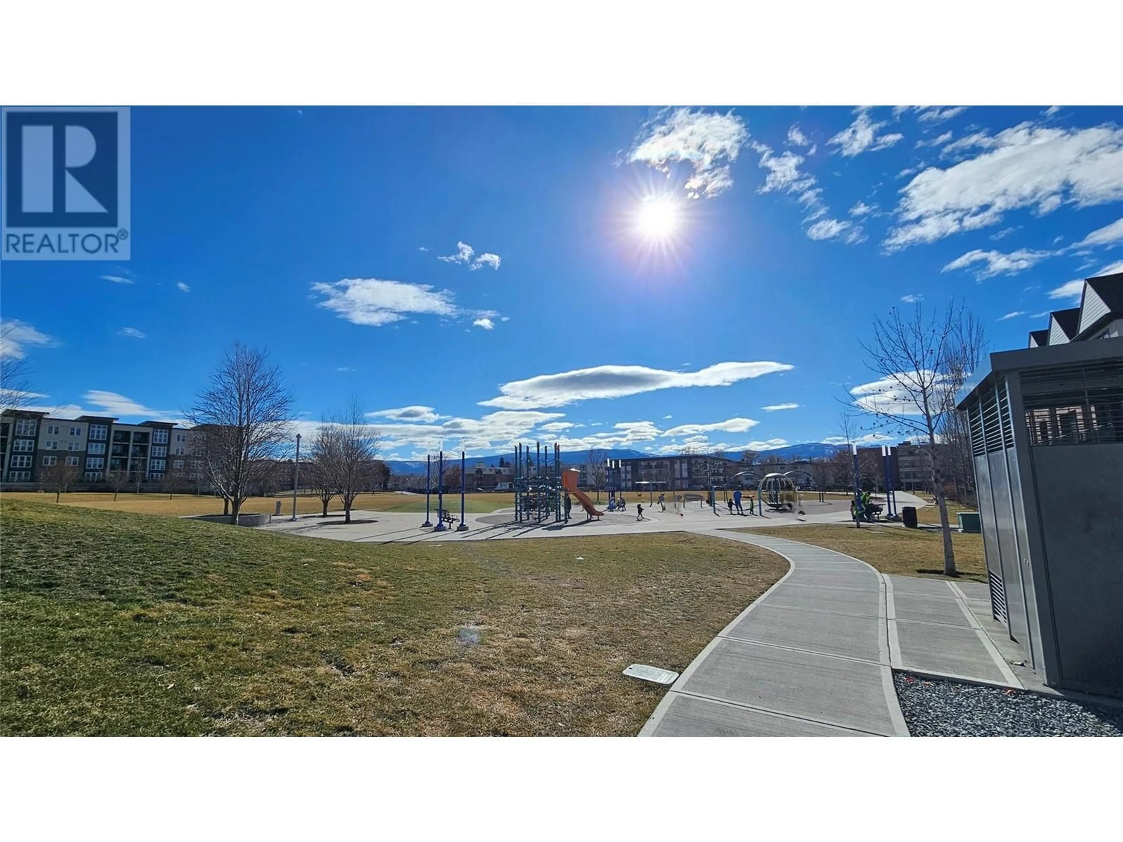 A pic from outside/outdoor area/front of a property/back of a property/a pic from drone, mountain view for 1775 Chapman Place Unit# 303, Kelowna British Columbia V1Y0G3