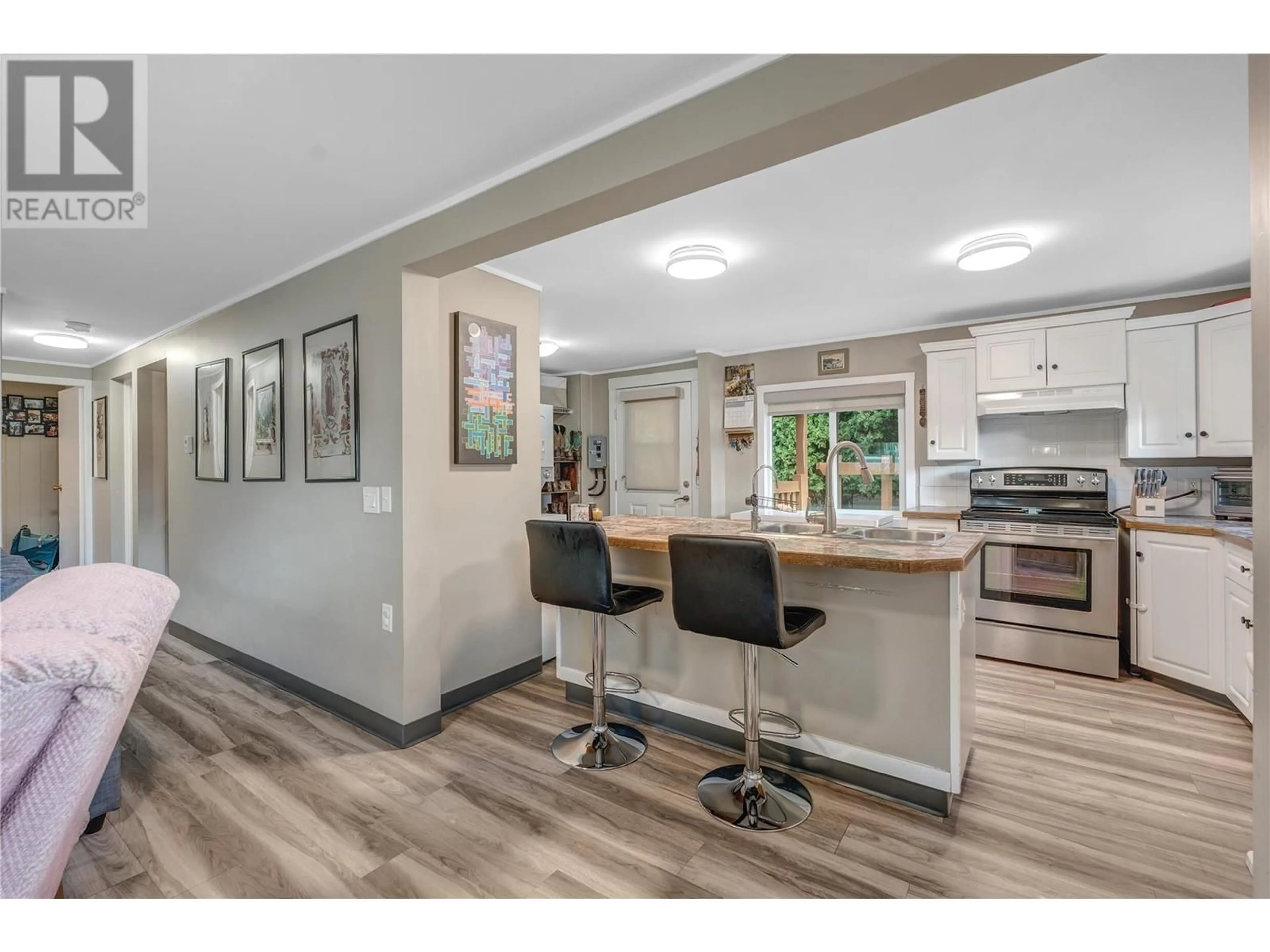 Open concept kitchen, wood/laminate floor for 4740 MIMAC COURT, Okanagan Falls British Columbia V0H1R2