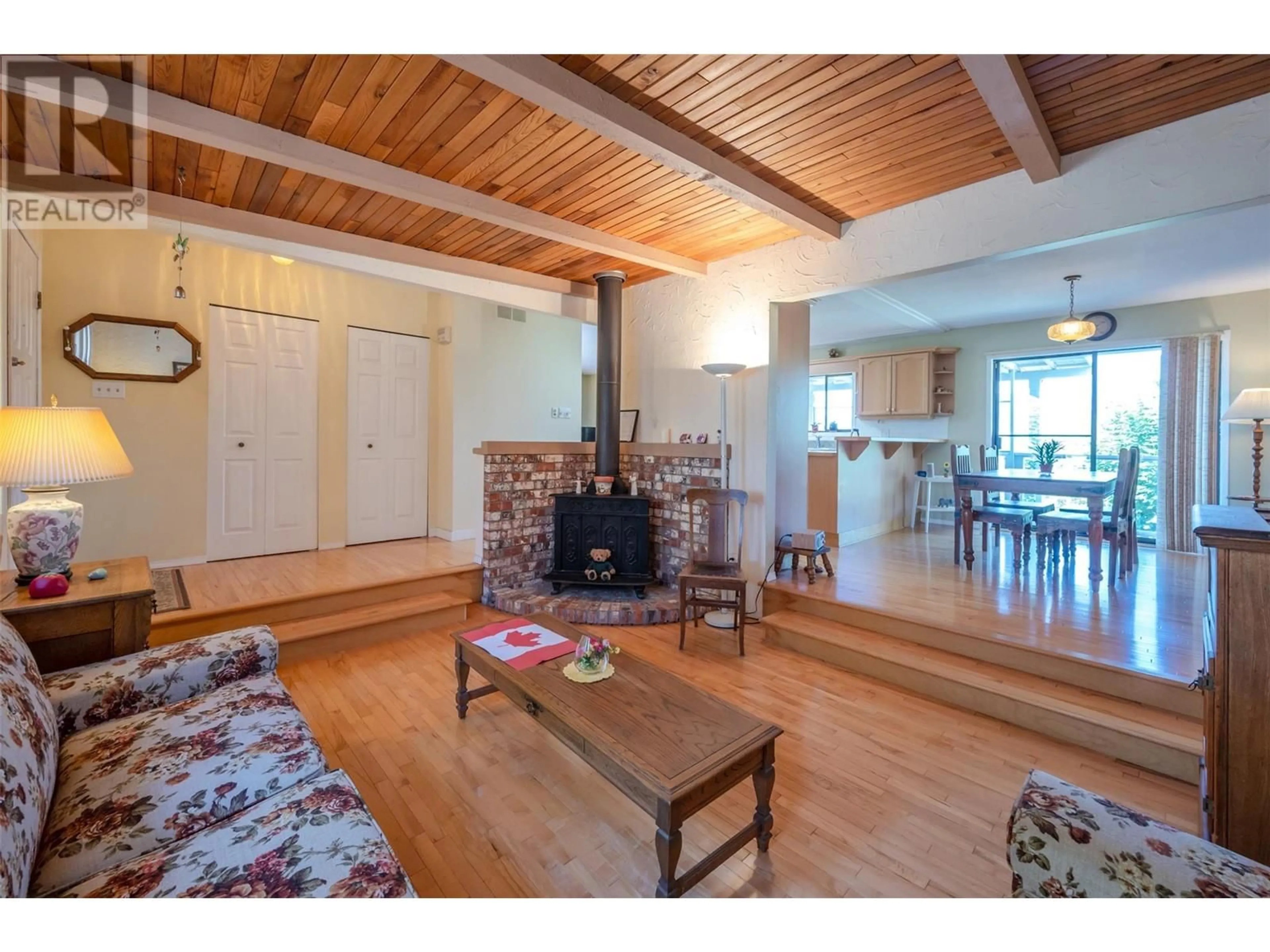 Living room with furniture, wood/laminate floor for 3906 DESERT PINES AVENUE, Peachland British Columbia V0H1X2