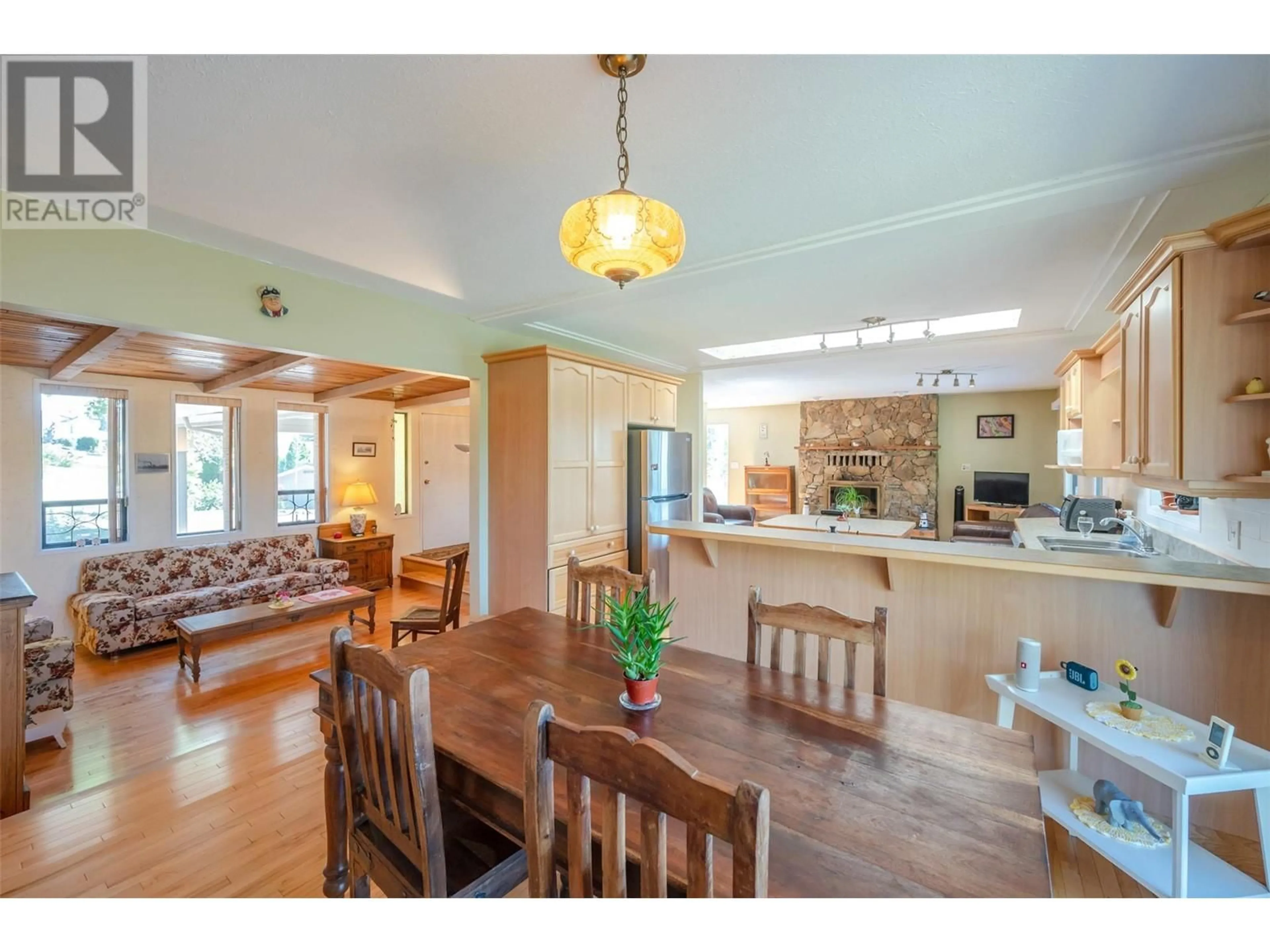 Open concept kitchen, wood/laminate floor for 3906 DESERT PINES AVENUE, Peachland British Columbia V0H1X2