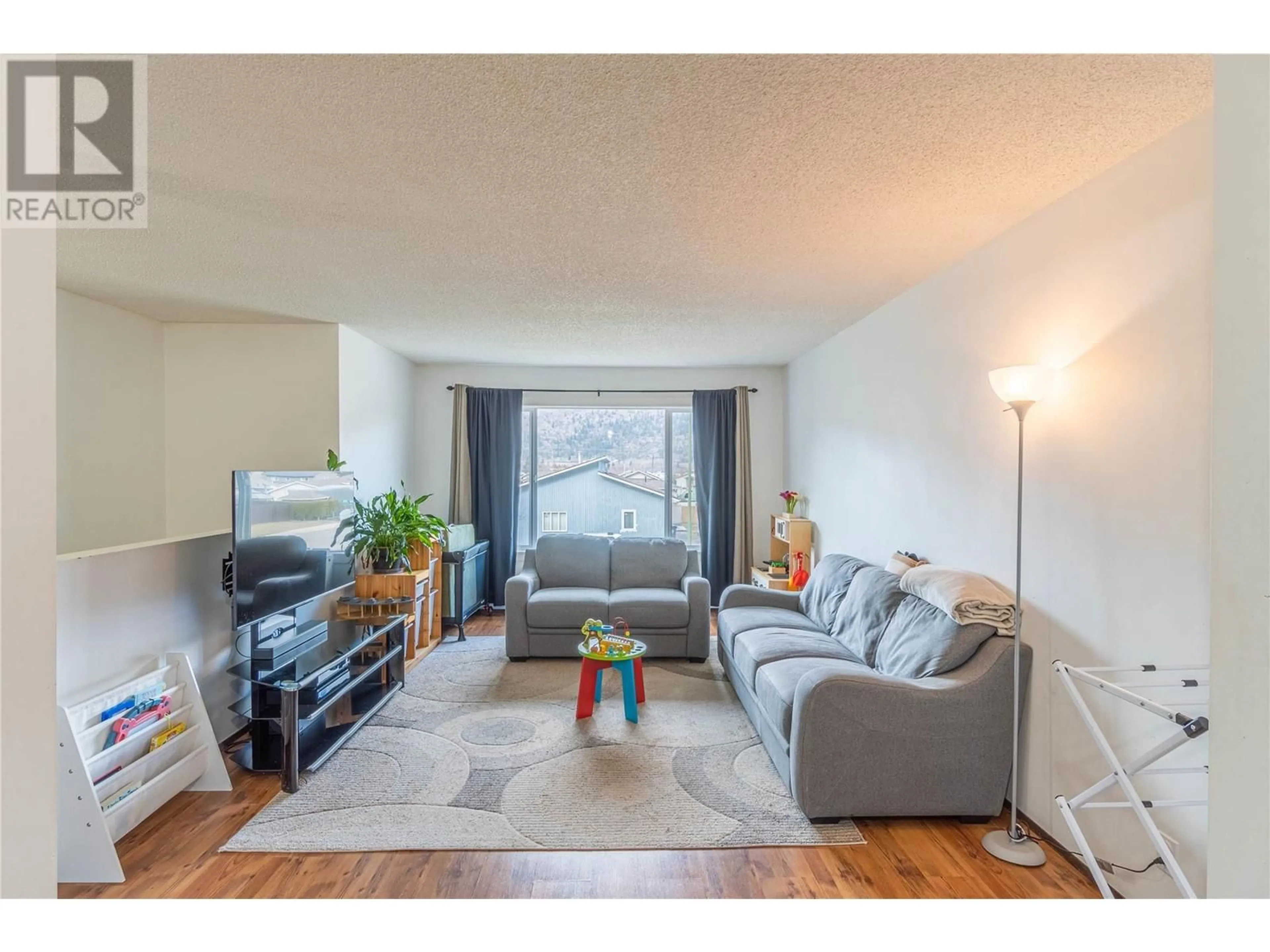 Living room with furniture, wood/laminate floor for 217 BROOKE Drive Unit# A, Chase British Columbia V0E1M0