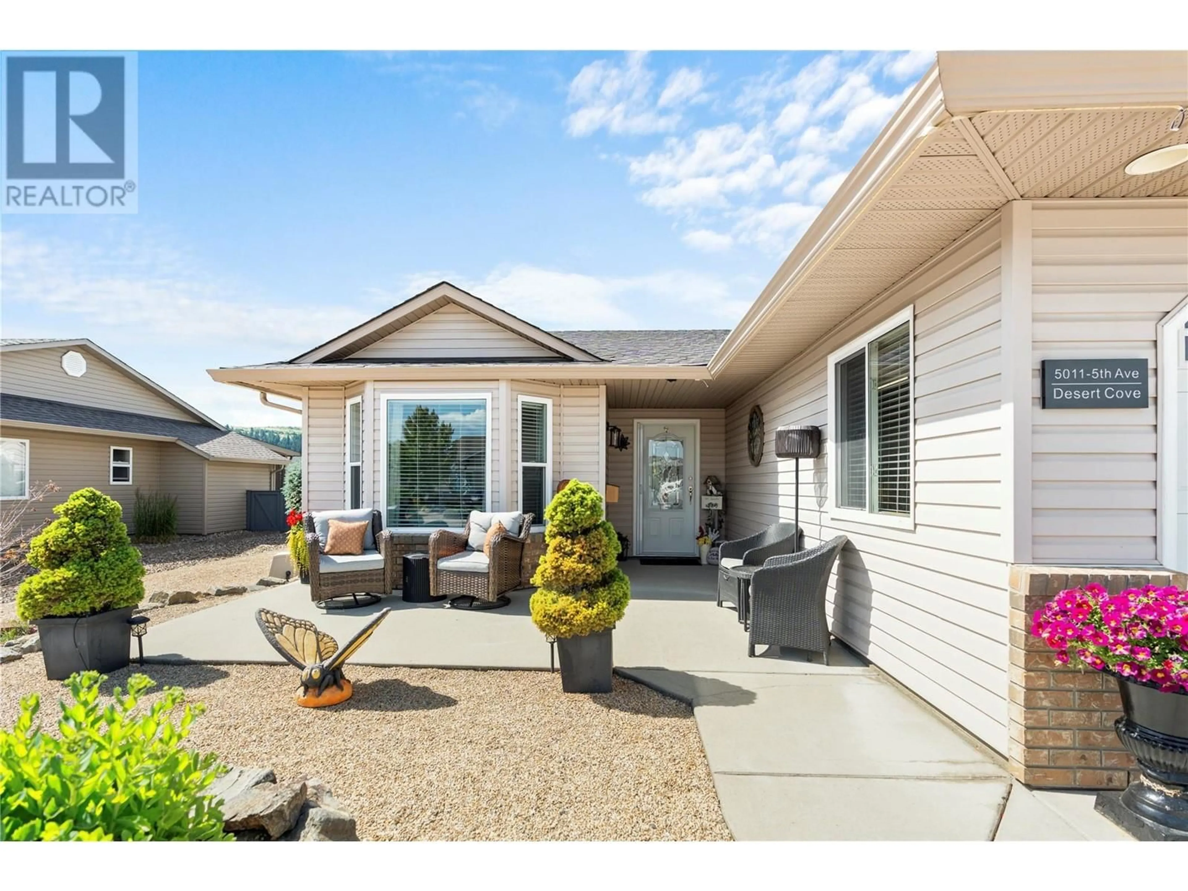 Home with vinyl exterior material, street for 5011 5 Avenue, Vernon British Columbia V1H1Z1