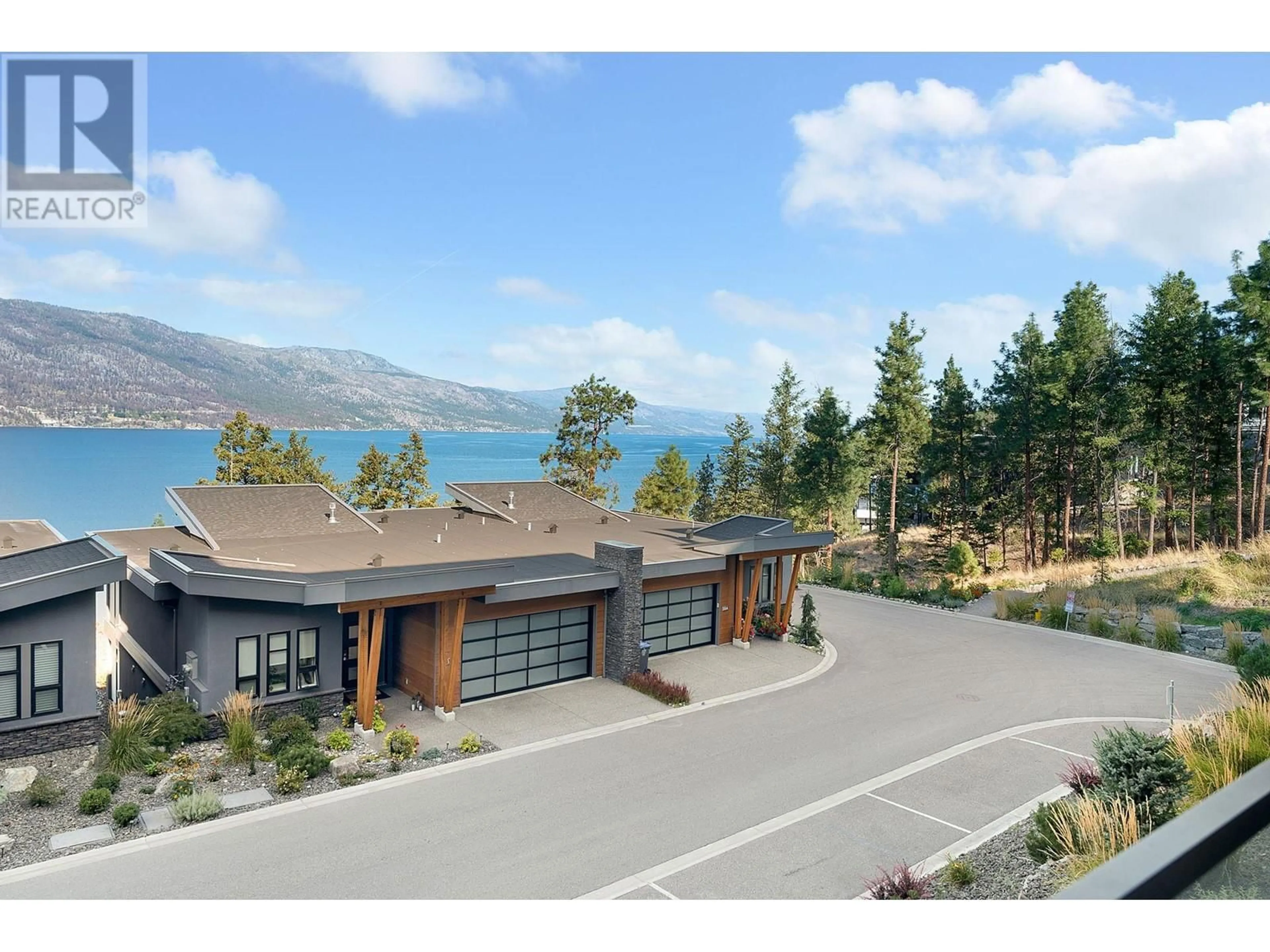 A pic from outside/outdoor area/front of a property/back of a property/a pic from drone, water/lake/river/ocean view for 104 - 3475 GRANITE CLOSE, Kelowna British Columbia V1V0B9