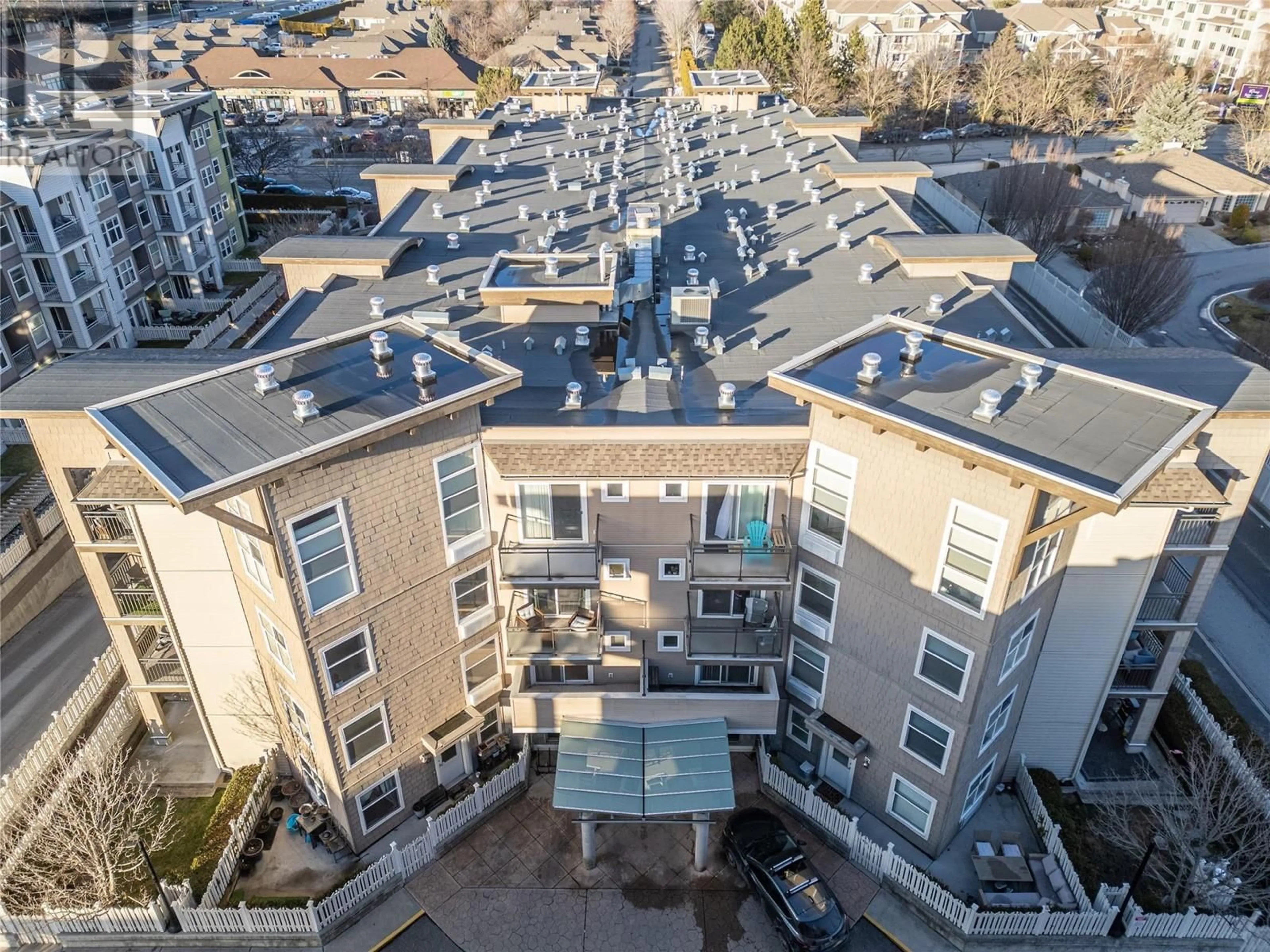 A pic from outside/outdoor area/front of a property/back of a property/a pic from drone, city buildings view from balcony for 204 - 533 YATES ROAD, Kelowna British Columbia V1V2T7