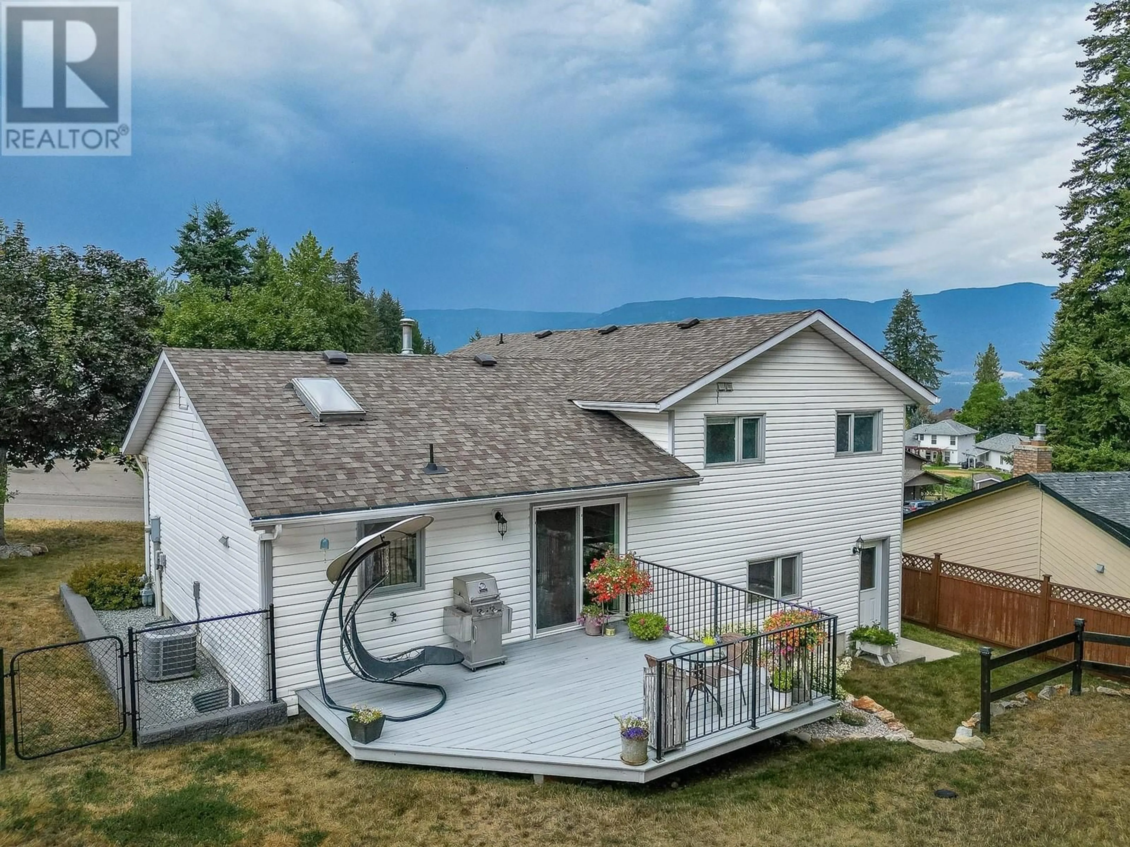 A pic from outside/outdoor area/front of a property/back of a property/a pic from drone, mountain view for 1630 17 Street SE, Salmon Arm British Columbia V1E2M6