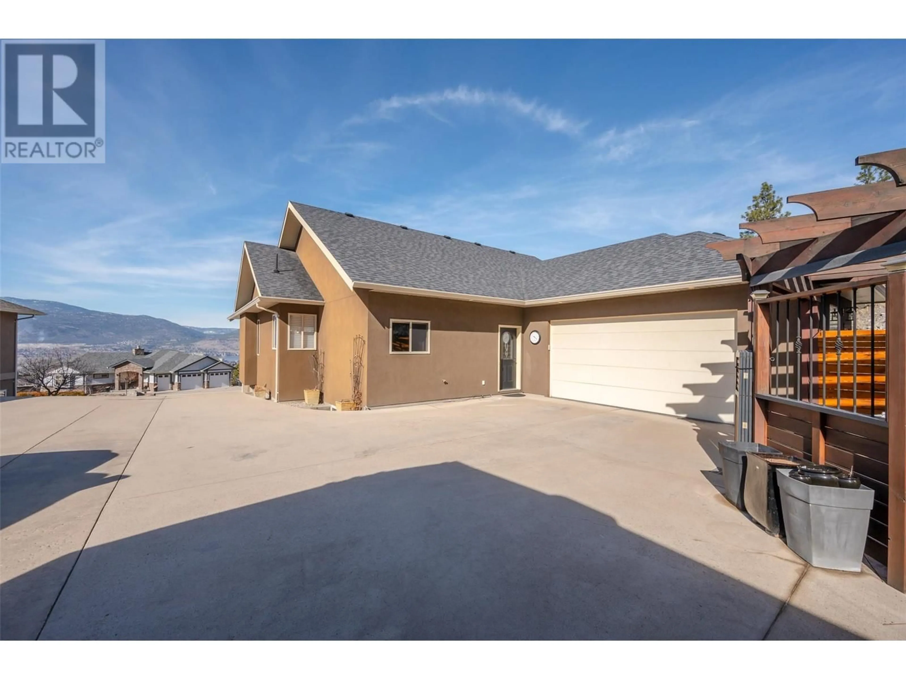 A pic from outside/outdoor area/front of a property/back of a property/a pic from drone, mountain view for 1564 Holden Road, Penticton British Columbia V2A8M9