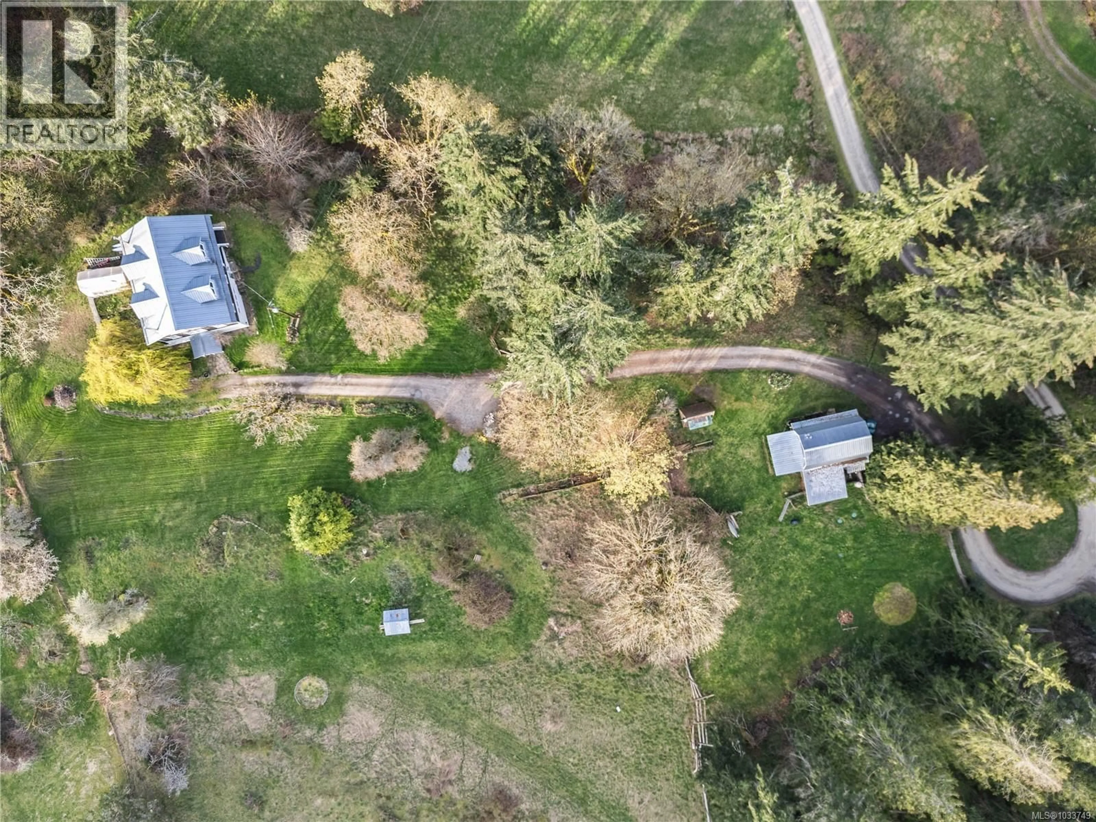 A pic from outside/outdoor area/front of a property/back of a property/a pic from drone, forest/trees view for 301 EPRON ROAD, Salt Spring British Columbia V8K2B4