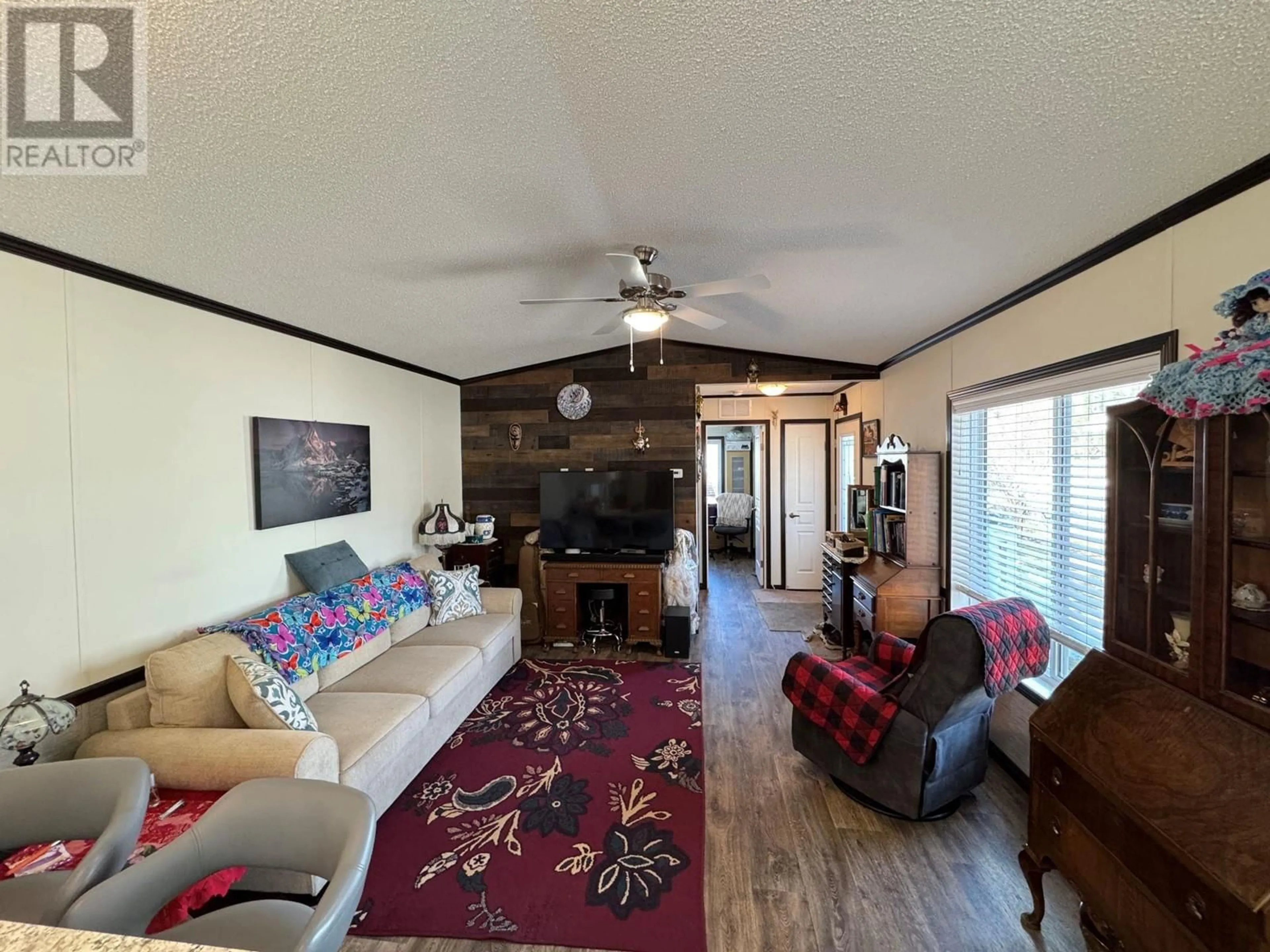 Living room with furniture, wood/laminate floor for C6 - 5455 ALMOND GARDENS ROAD, Grand Forks British Columbia V0H1H4