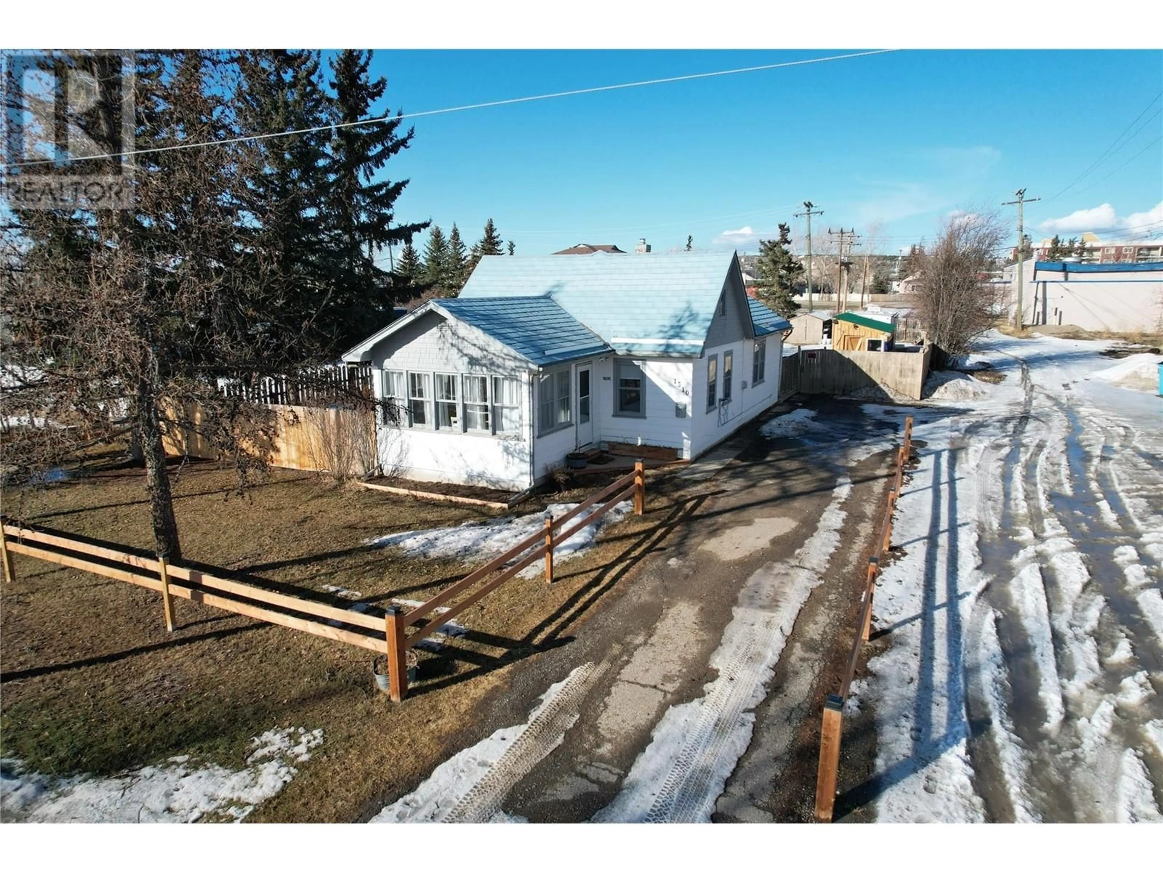 A pic from outside/outdoor area/front of a property/back of a property/a pic from drone, street for 1310 104 Avenue, Dawson Creek British Columbia V1G2J6