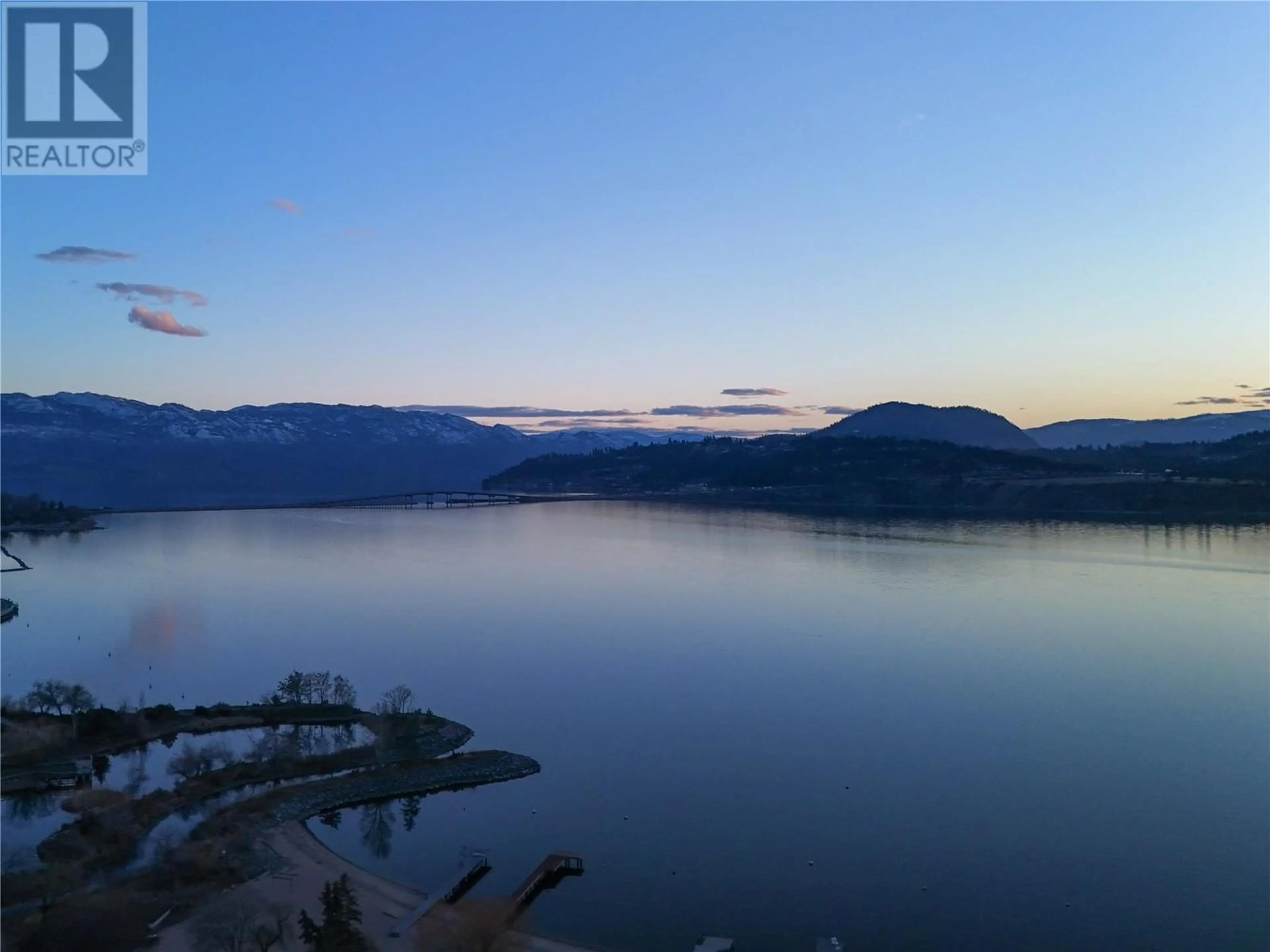 A pic from outside/outdoor area/front of a property/back of a property/a pic from drone, water/lake/river/ocean view for 2101 - 1151 SUNSET DRIVE, Kelowna British Columbia V1Y0G2