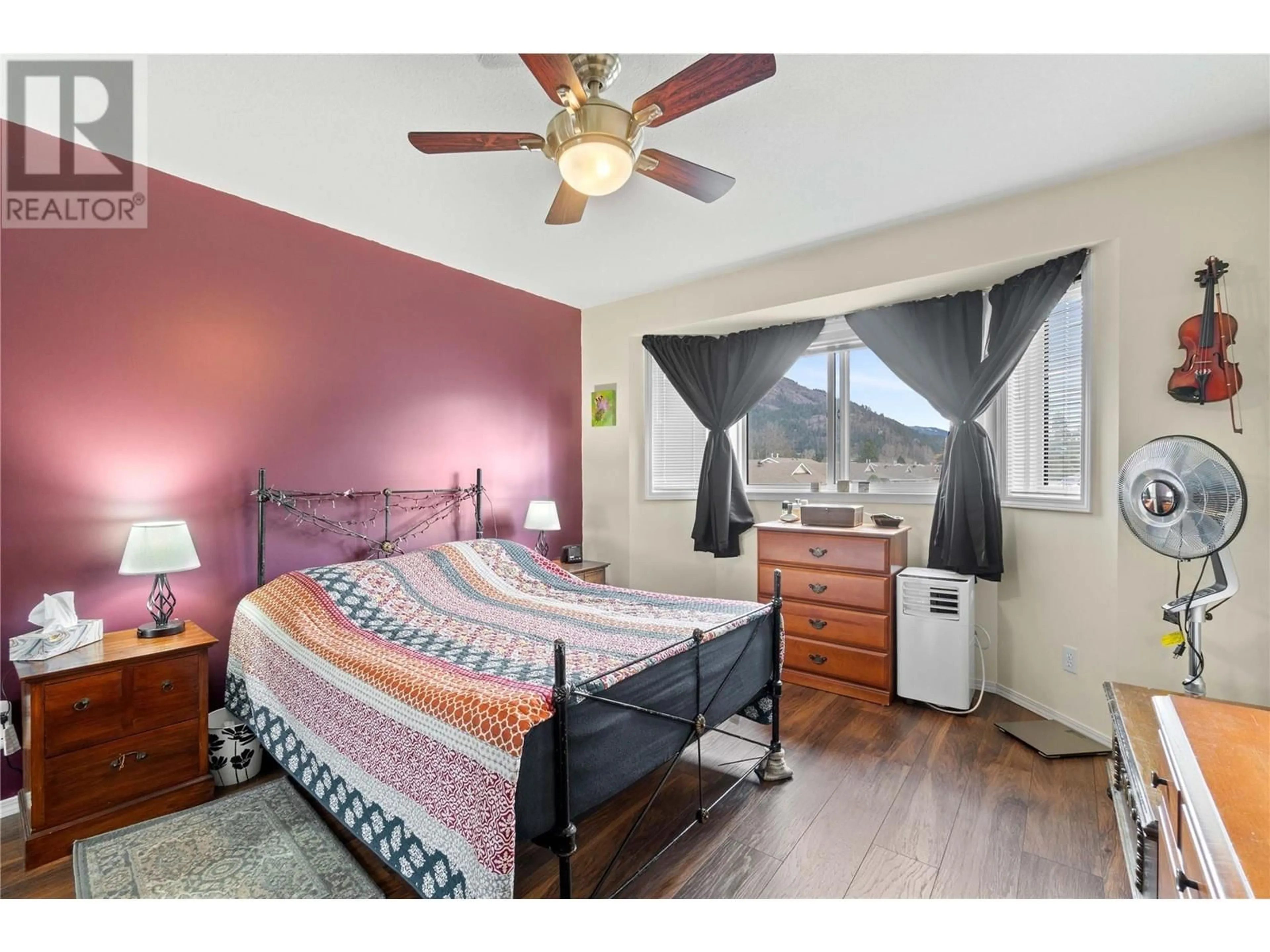 Bedroom with bed, wood/laminate floor for 210 - 211 KILDONAN AVENUE, Enderby British Columbia V0E1V2