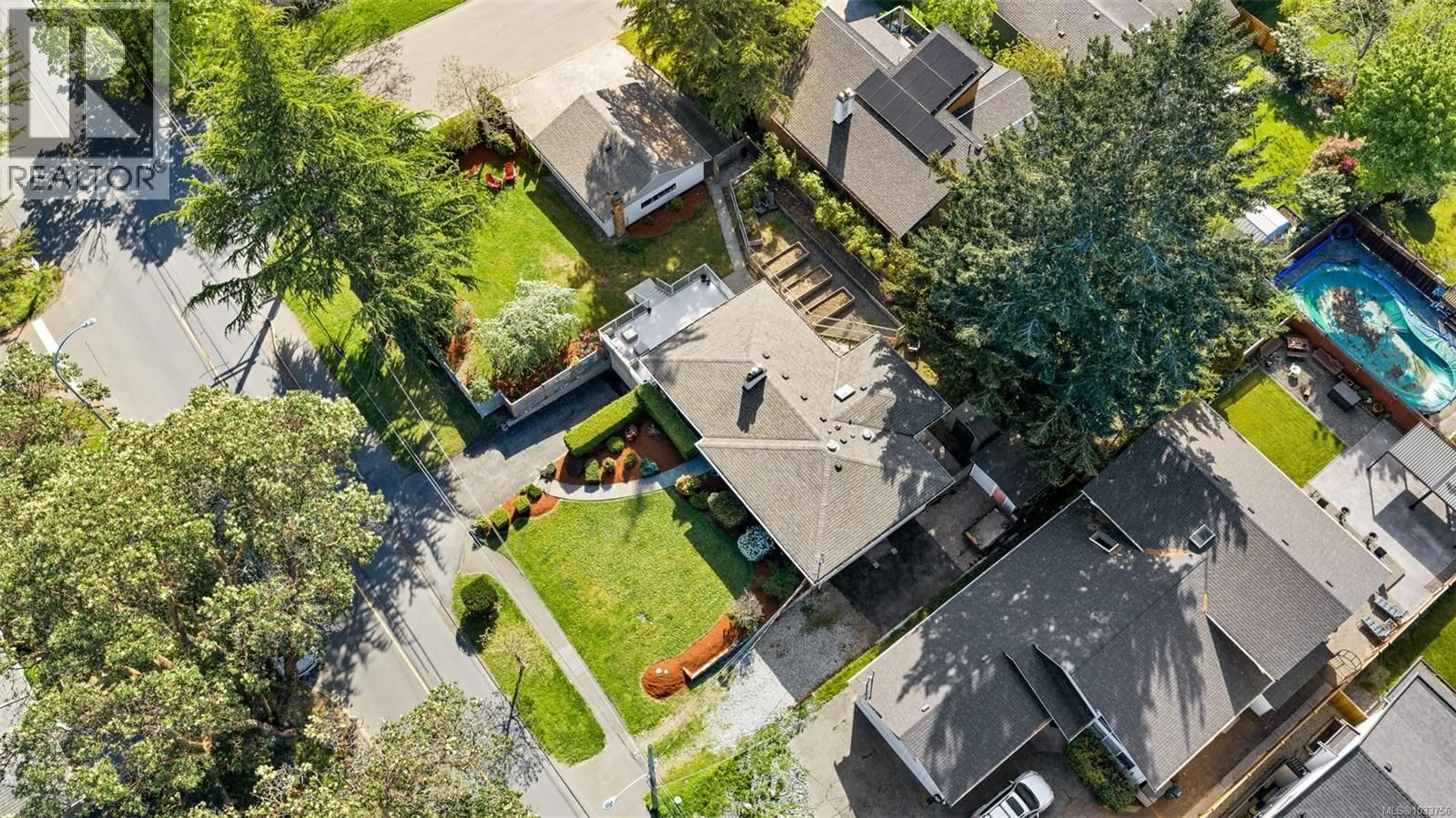 A pic from outside/outdoor area/front of a property/back of a property/a pic from drone, street for 4474 TORQUAY DRIVE, Saanich British Columbia V8N3L5