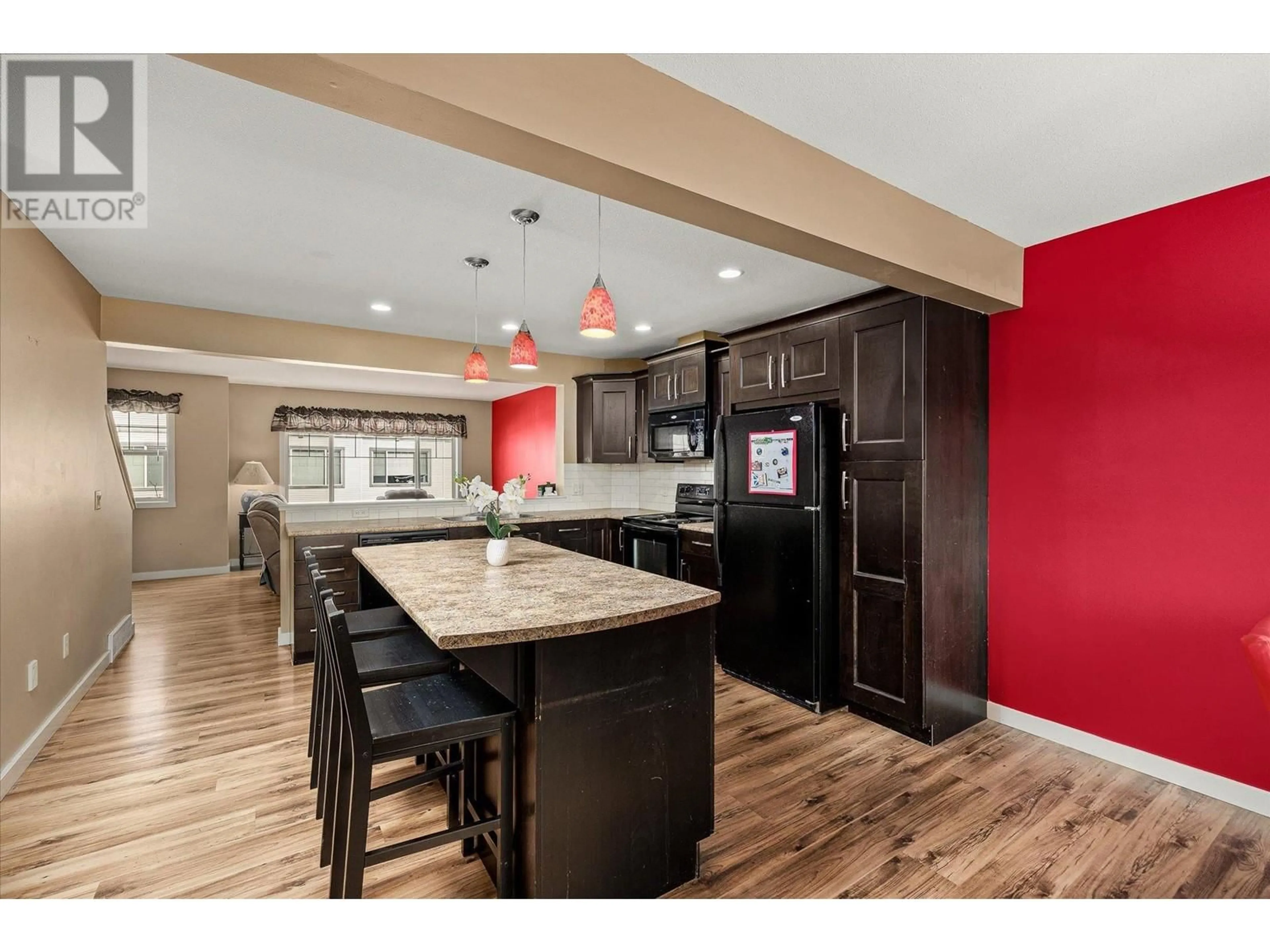 Open concept kitchen, wood/laminate floor for 103 - 440 HARTMAN ROAD, Kelowna British Columbia V1X2N1