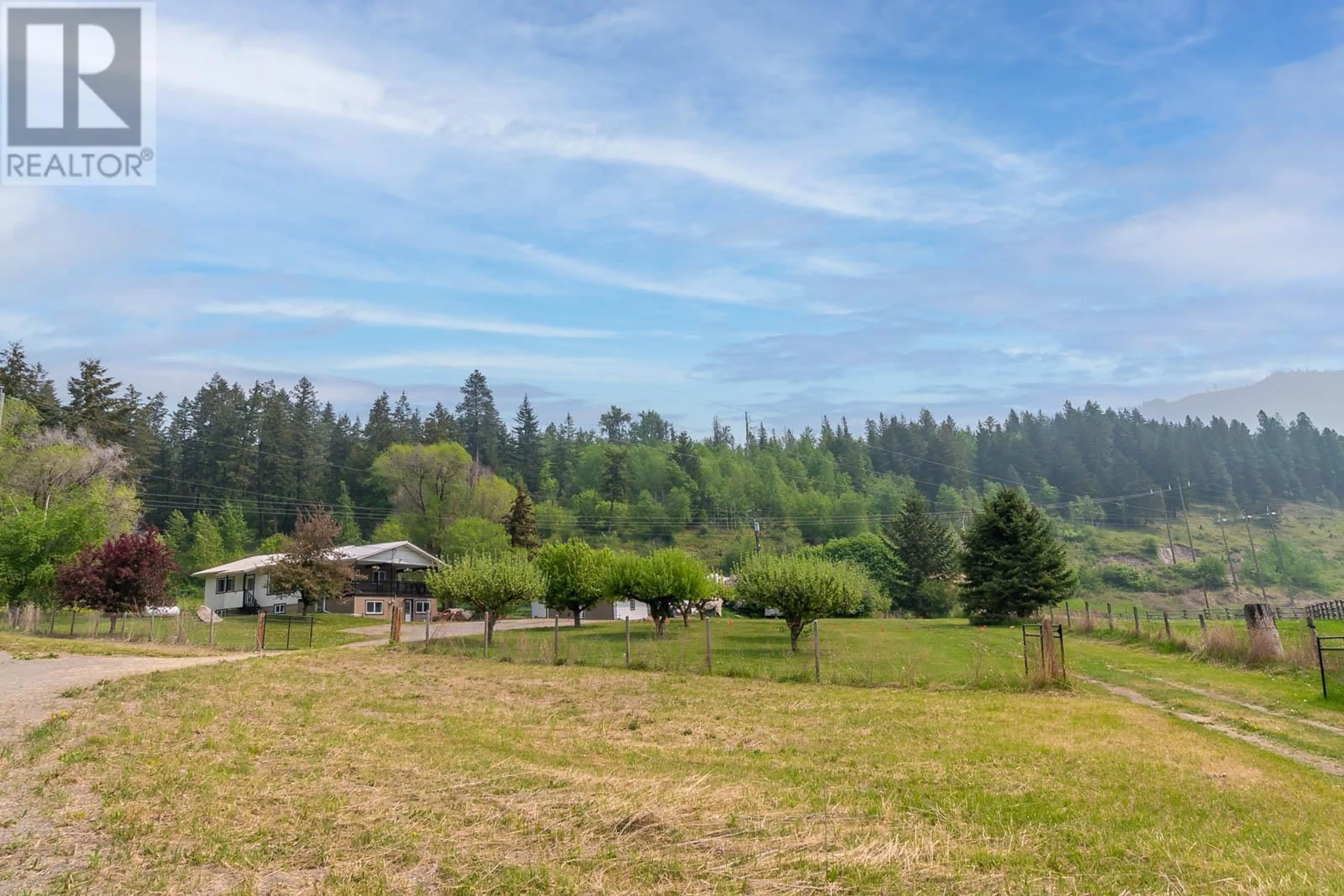 A pic from outside/outdoor area/front of a property/back of a property/a pic from drone, forest/trees view for 5479 SILVERNAILS ROAD, Falkland British Columbia V0E1W0