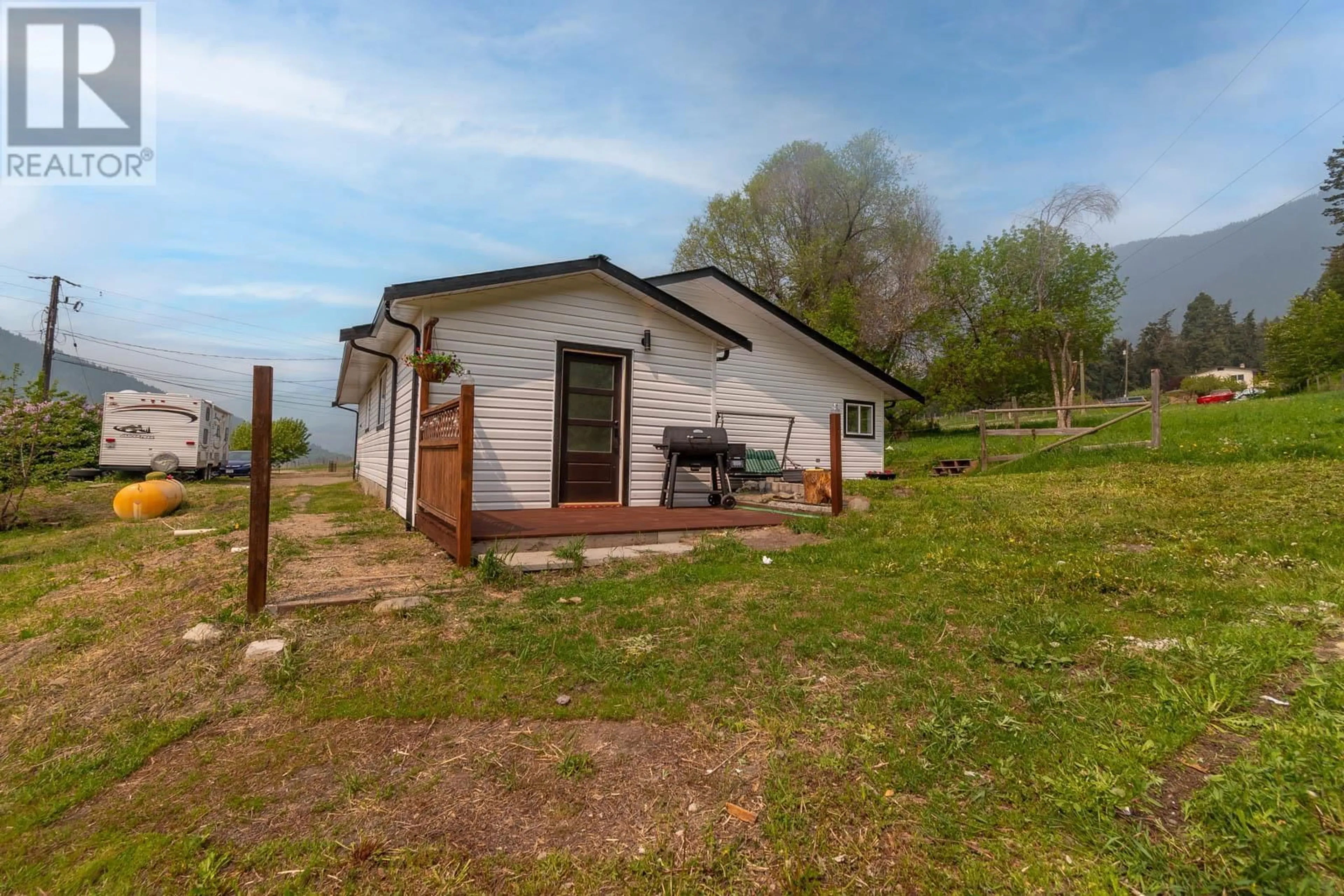 A pic from outside/outdoor area/front of a property/back of a property/a pic from drone, unknown for 5479 SILVERNAILS ROAD, Falkland British Columbia V0E1W0